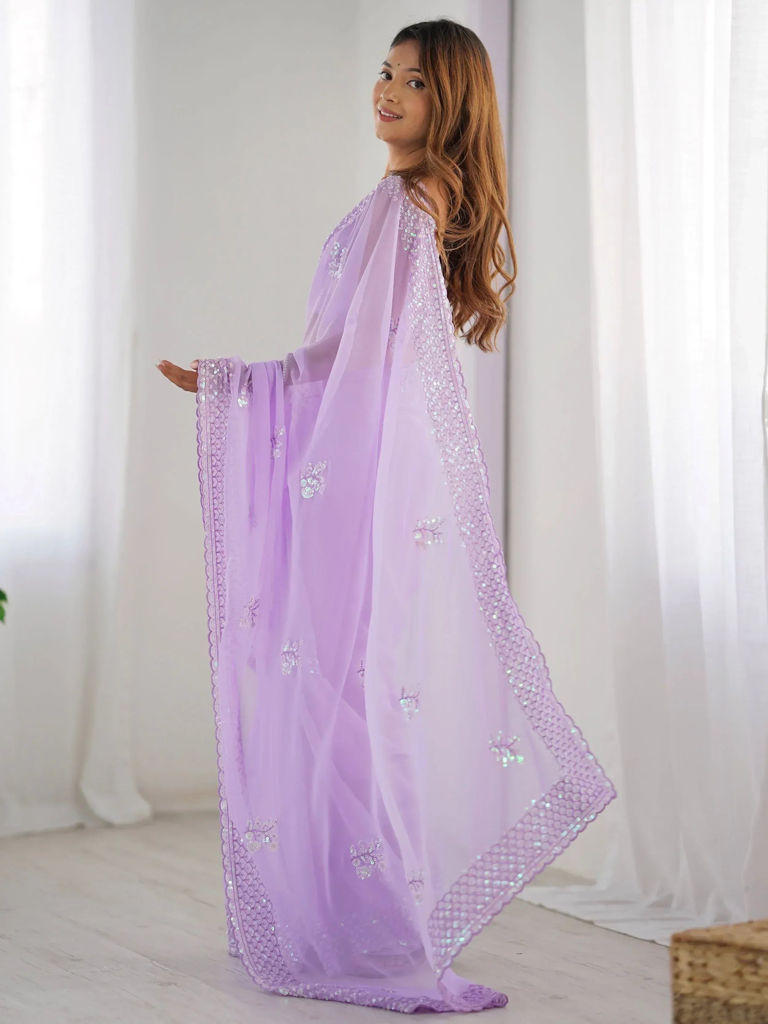 Lavender ethnic gown with sequin embroidery, perfect for Indian festive occasions and parties.