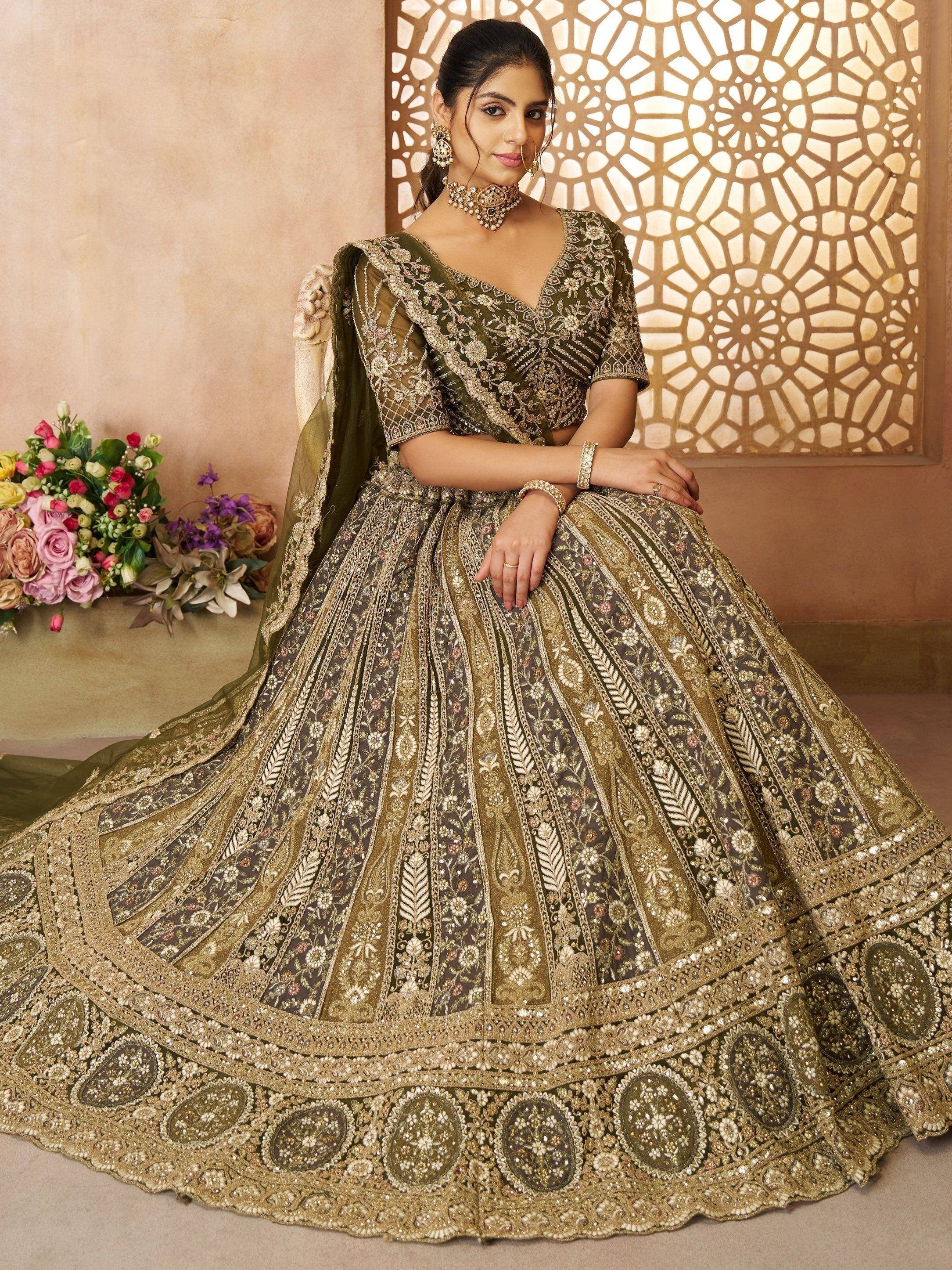 Olive green designer lehenga choli with heavy gold embroidery, perfect for Indian weddings and festive occasions.