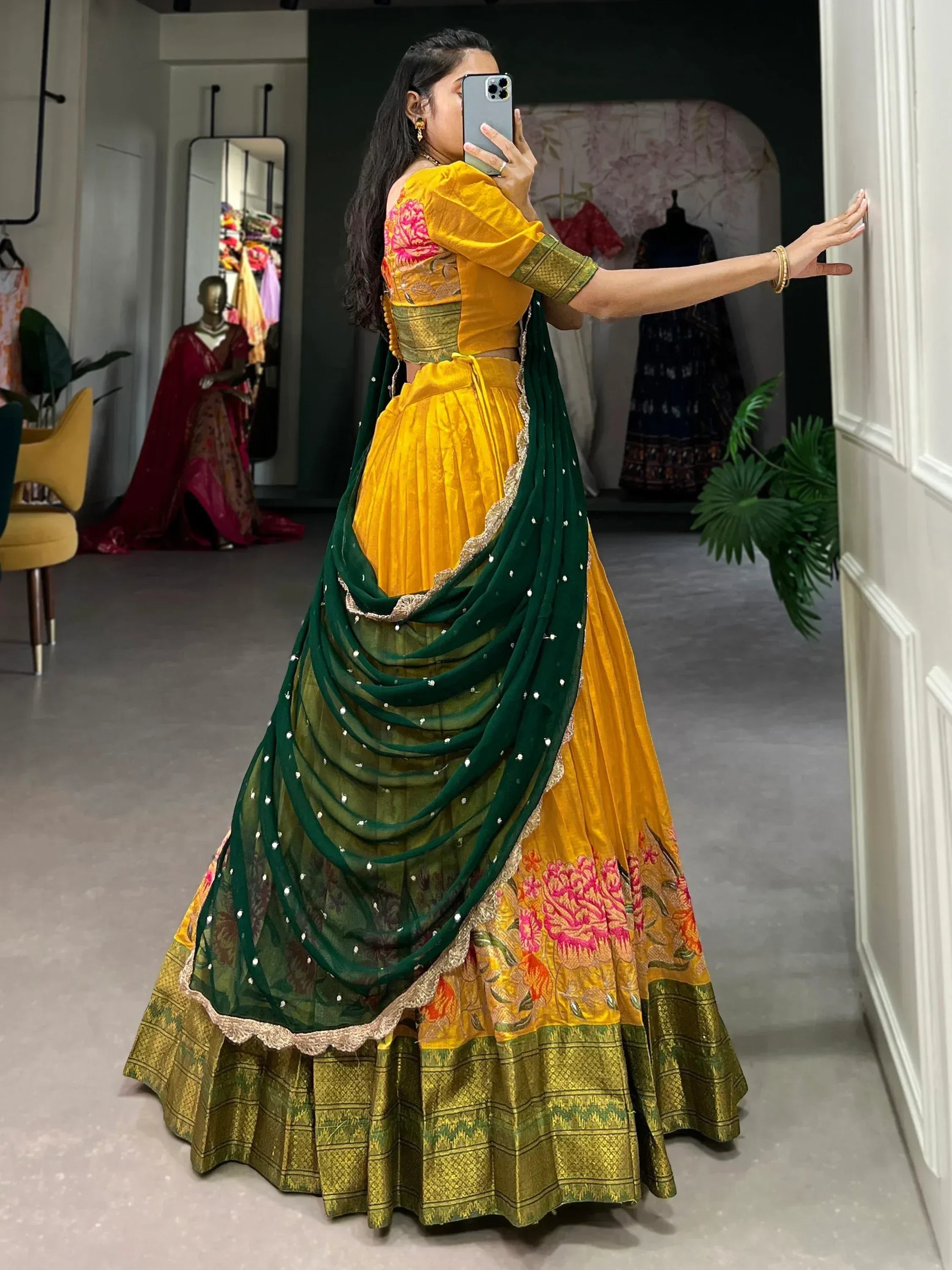 Yellow and green designer lehenga choli with floral embroidery and embellished dupatta, perfect for Indian ethnic wear.
