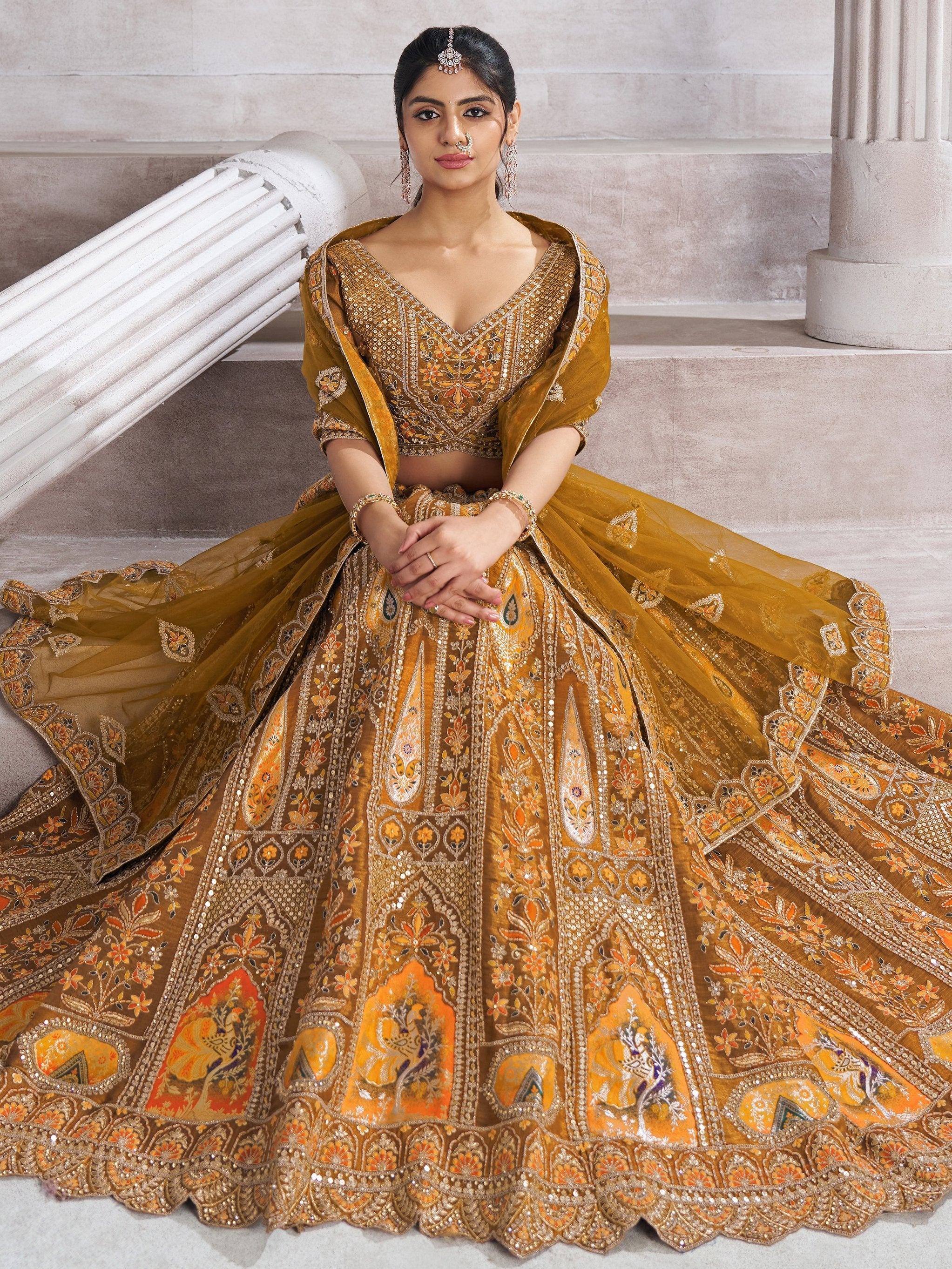 Elegant mustard yellow lehenga choli with intricate floral embroidery and sequin work, perfect for Indian weddings.