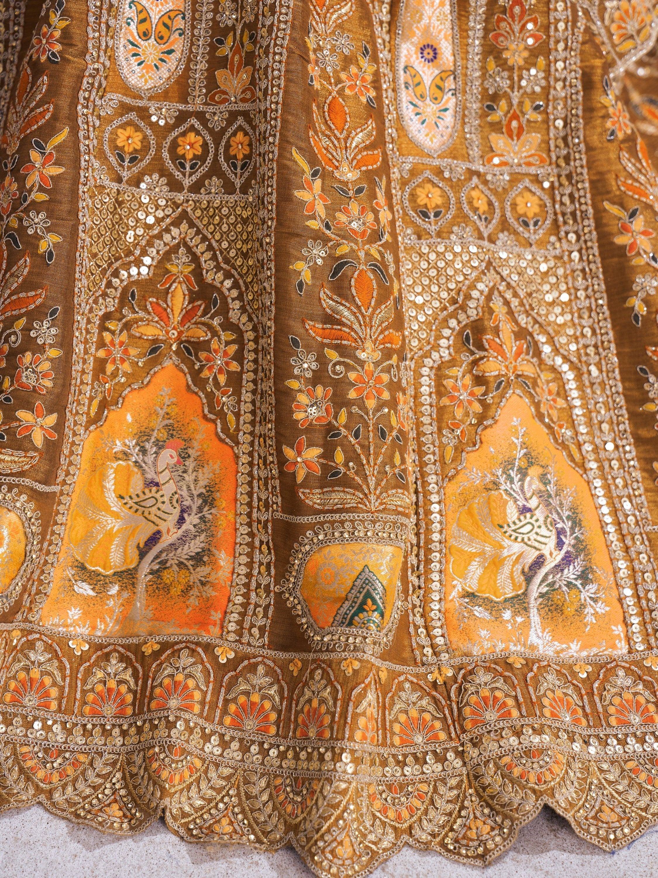 Golden ethnic lehenga with intricate floral embroidery, sequins, and peacock motifs for Indian weddings