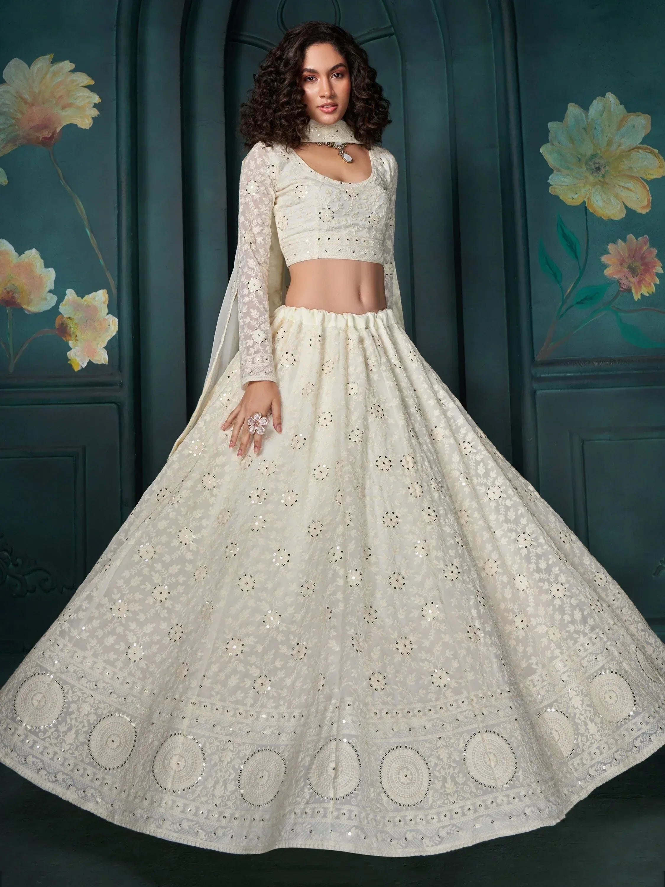 Elegant ivory lehenga choli with sequin embroidery, perfect for Indian ethnic wear and festive occasions.