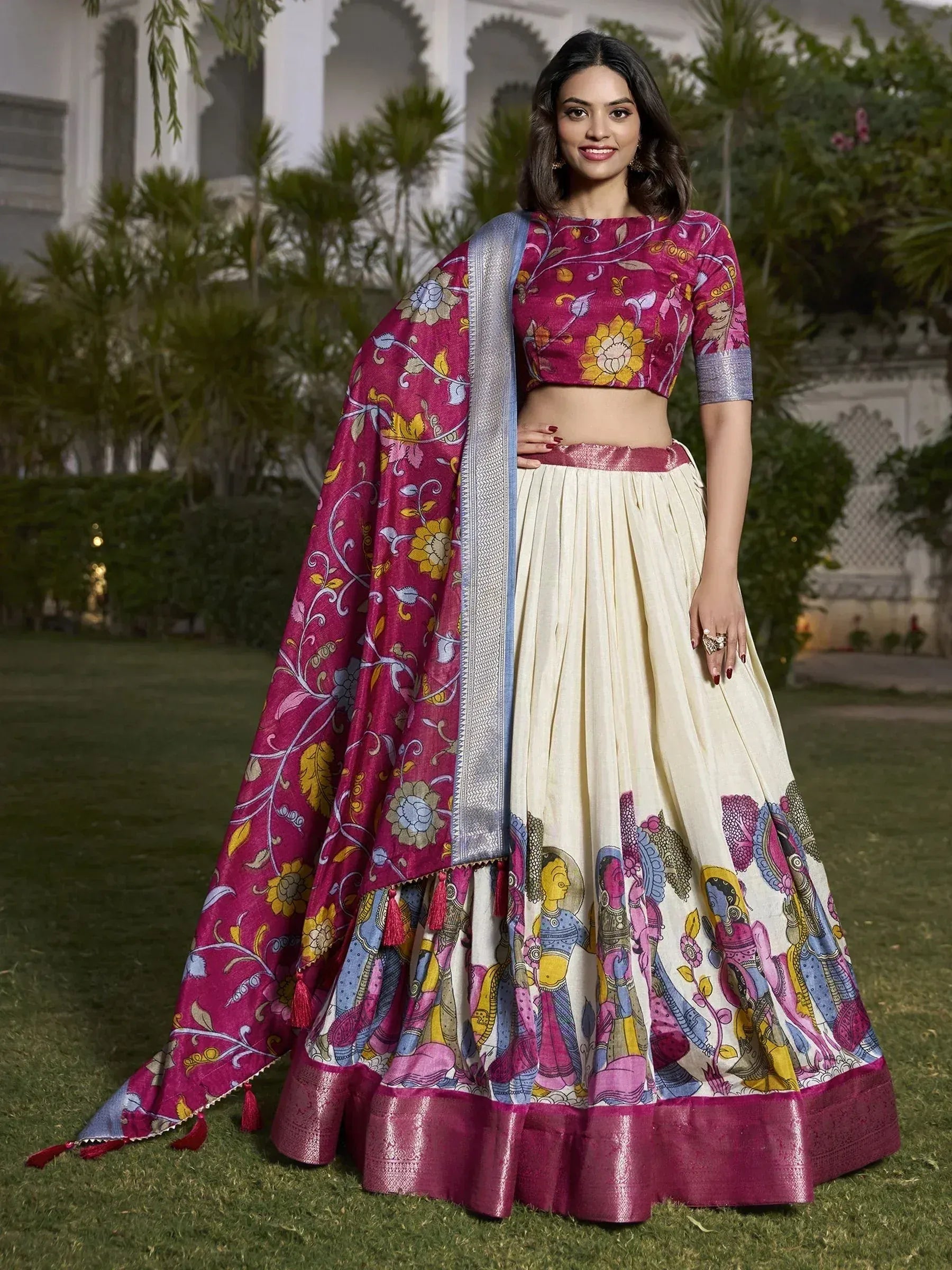Woman in vibrant floral and folk-art printed lehenga choli with dupatta, perfect for Indian ethnic occasions.