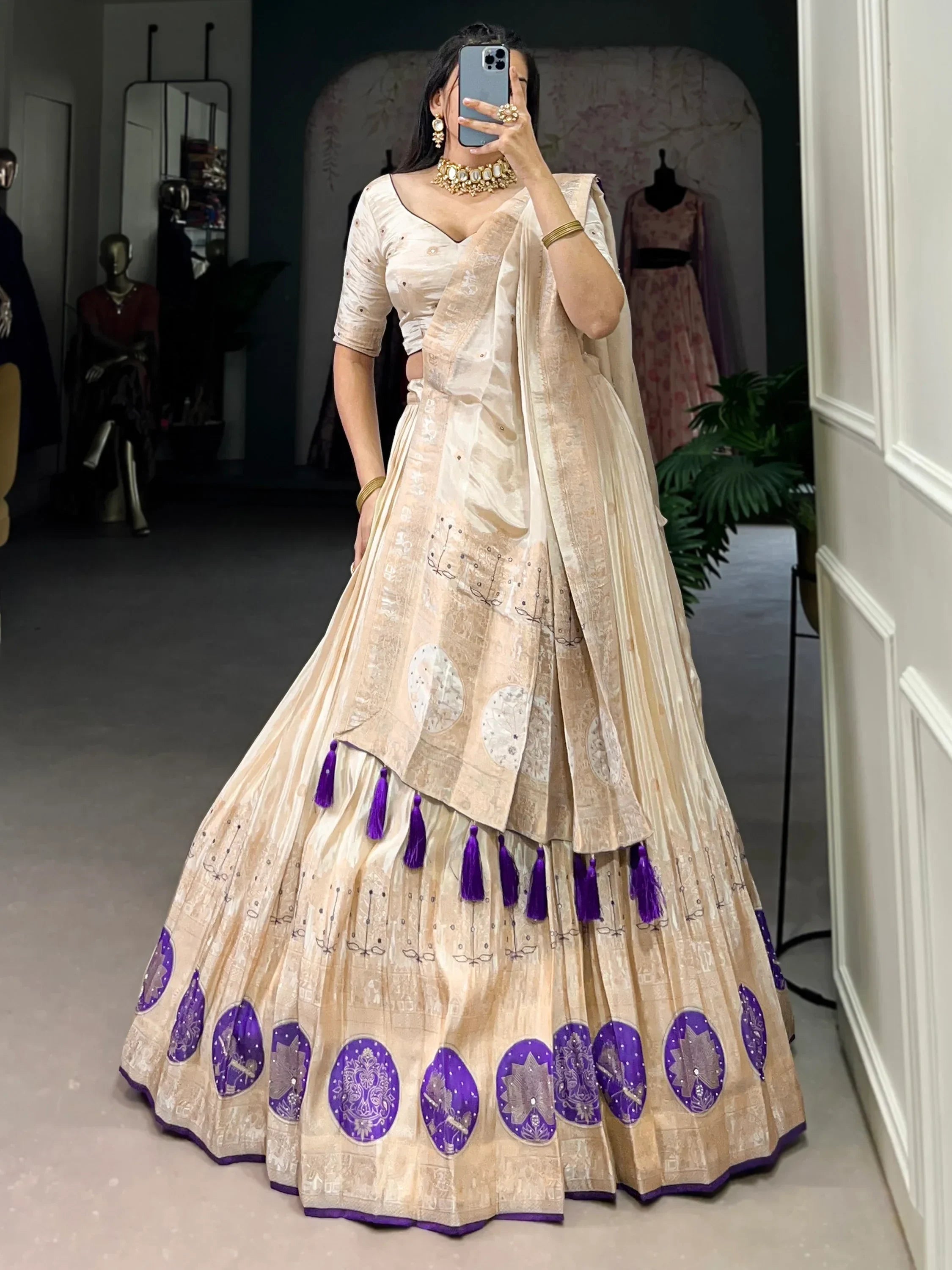 Cream and purple designer lehenga choli with embroidery and tassels, perfect for Indian ethnic wear