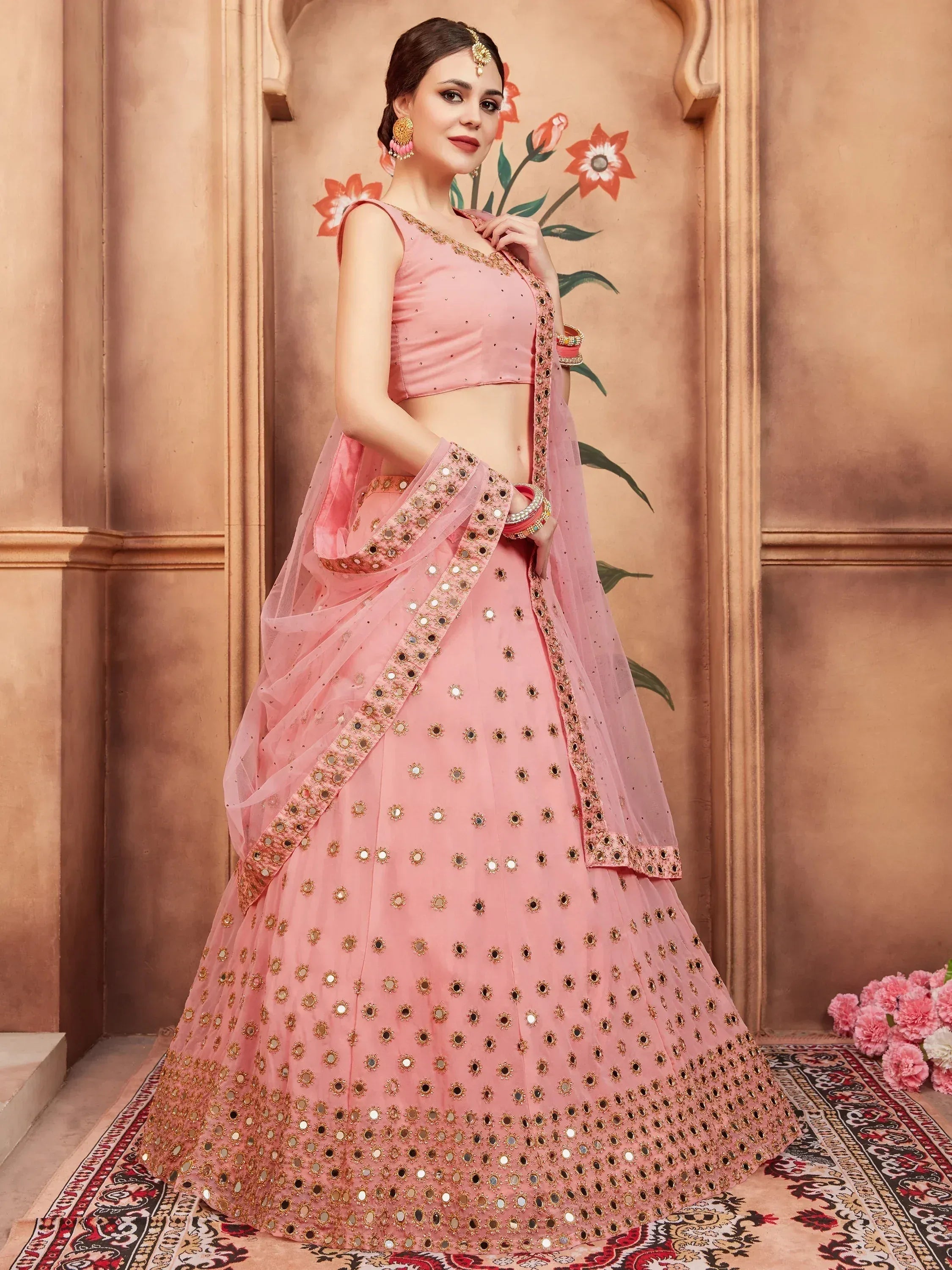 Pink designer lehenga choli with mirror work, perfect for Indian weddings and festive occasions