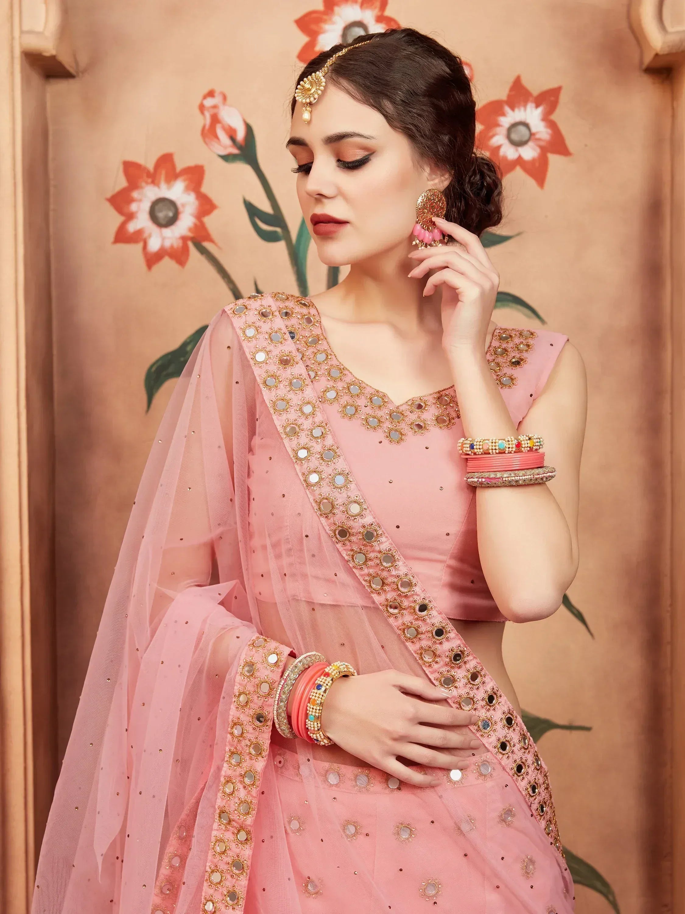 Pink mirror-work ethnic lehenga choli with dupatta, perfect for Indian weddings and festive occasions