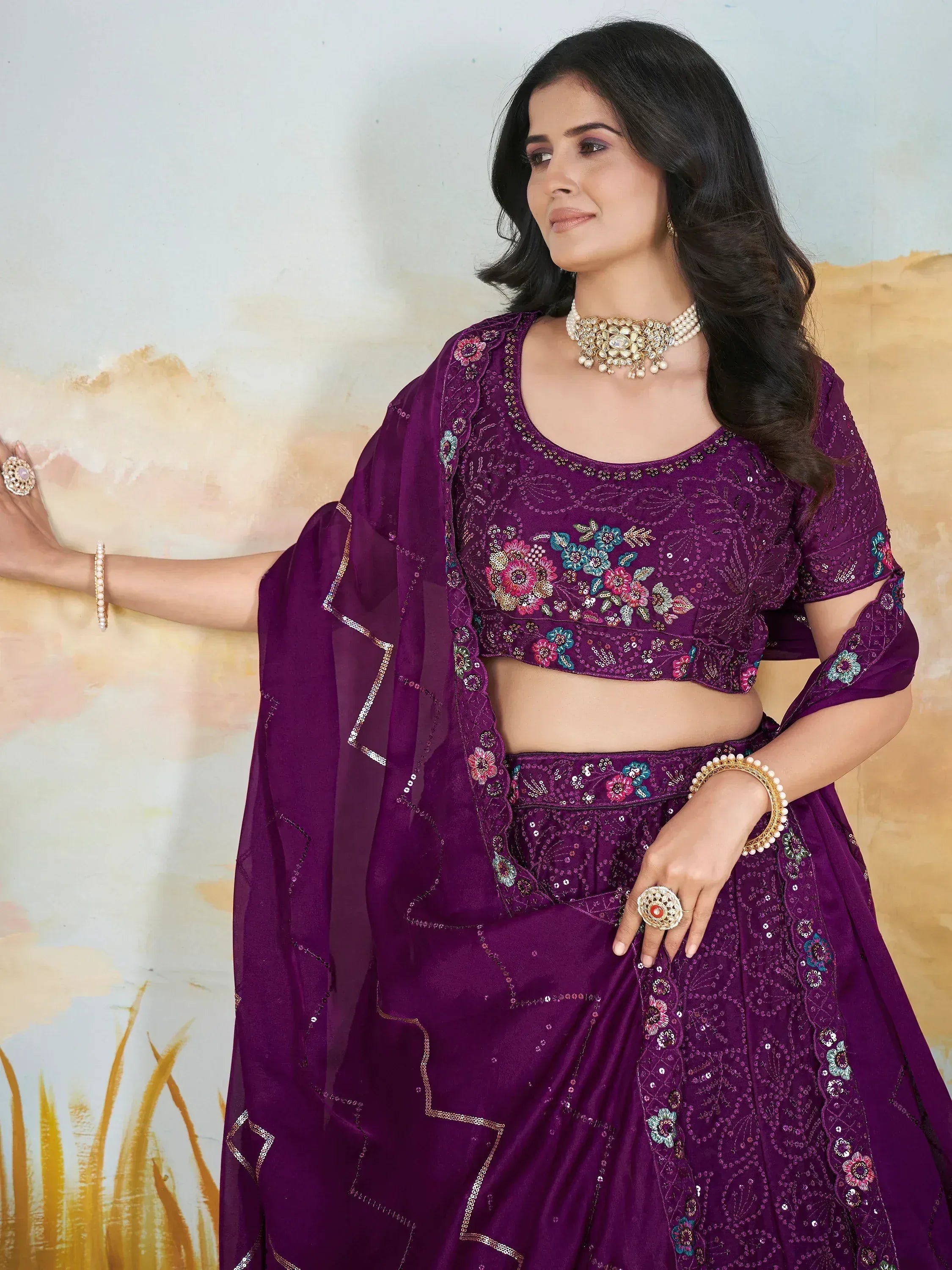 Purple embroidered lehenga choli with floral motifs and sequin detailing, perfect for Indian ethnic wear occasions.
