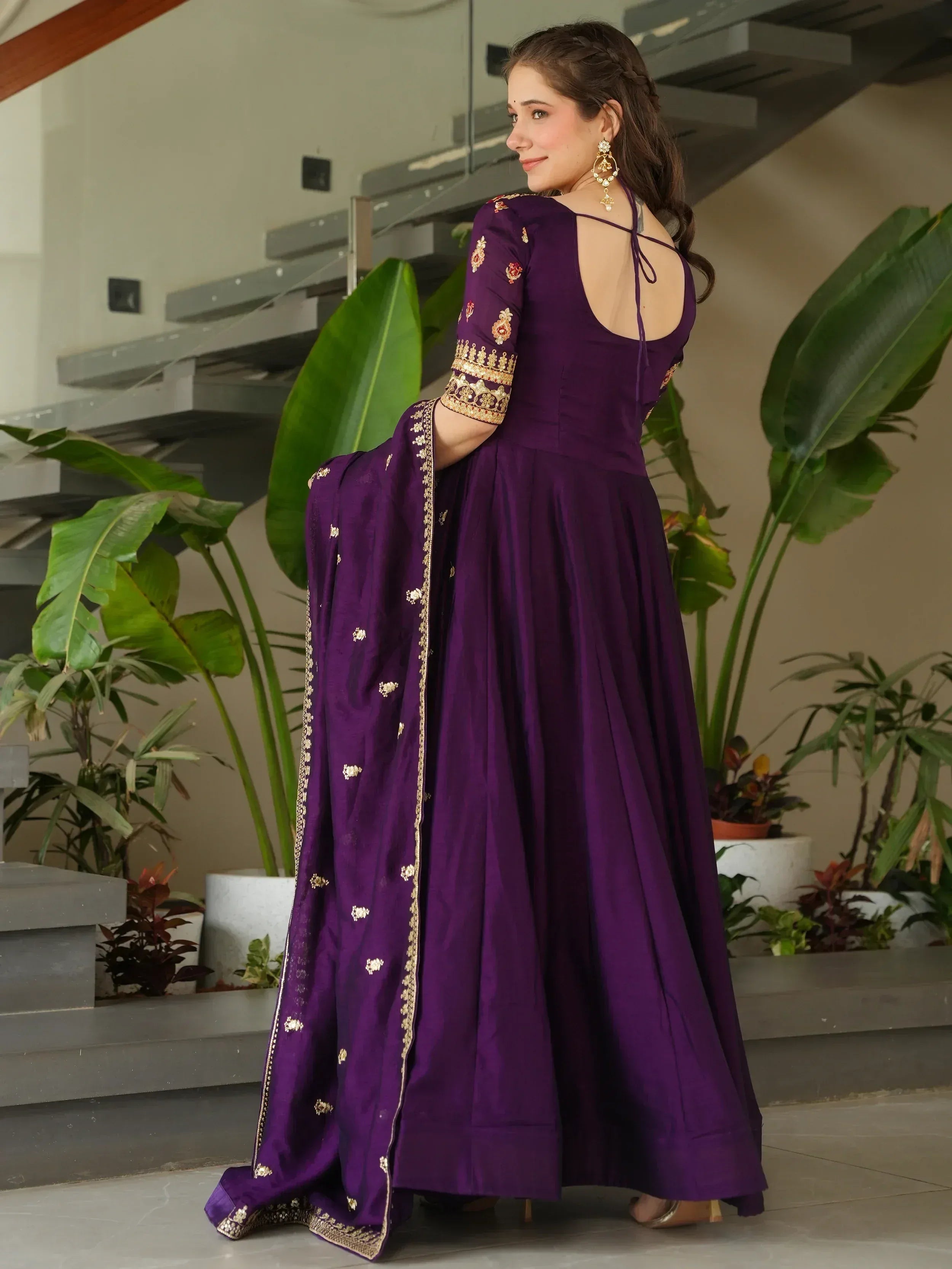 Purple Indian ethnic gown with gold embroidery, backless design, and matching dupatta for festive occasions