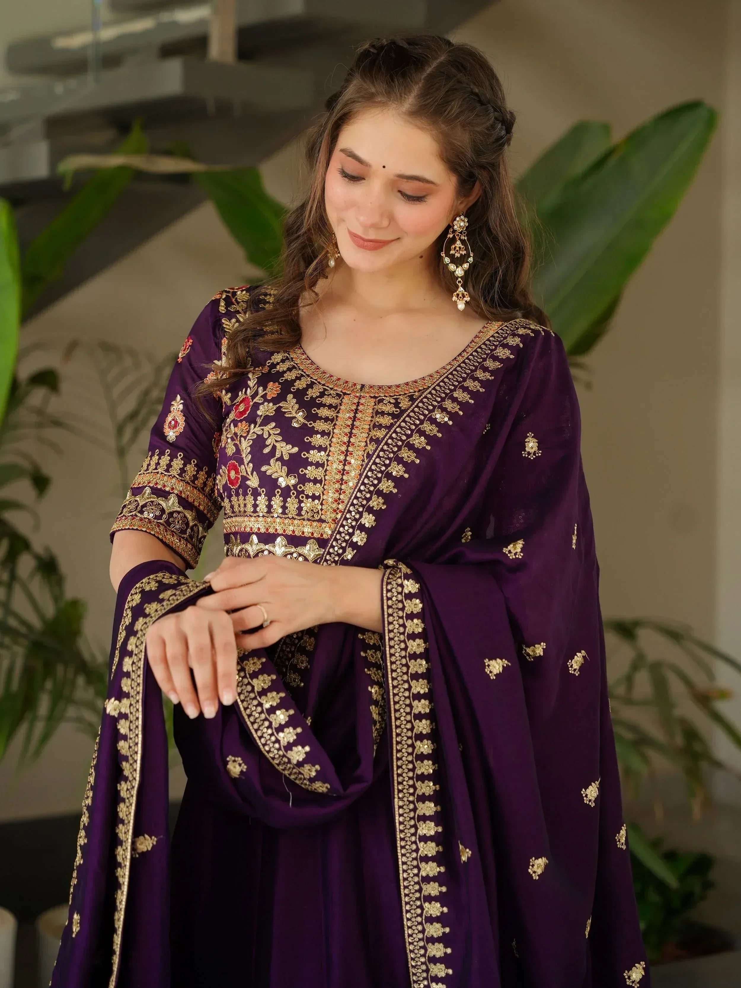 Purple embroidered salwar kameez with gold floral detailing, perfect for Indian ethnic wear occasions