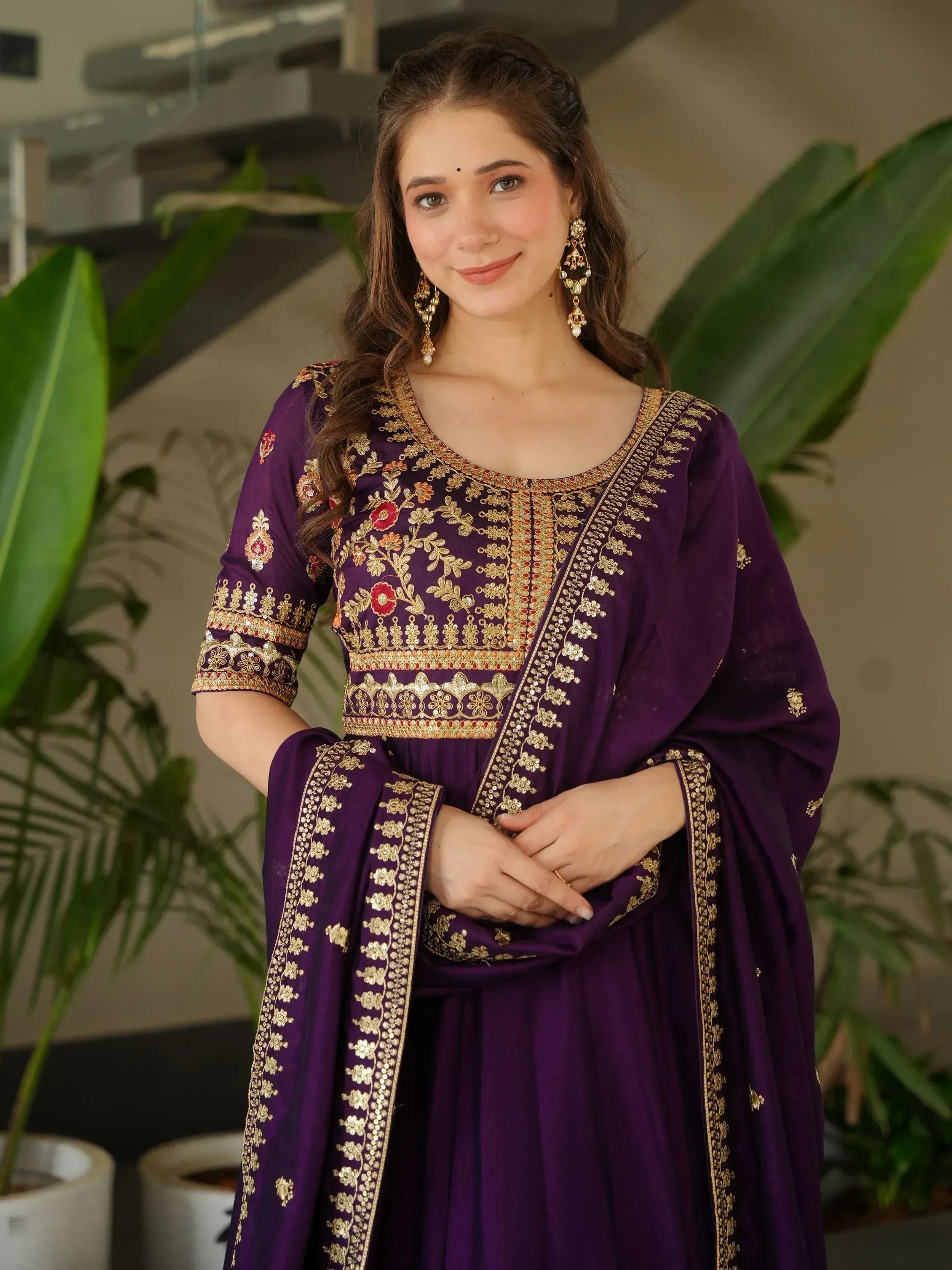 Purple embroidered Indian salwar kameez with gold floral work and matching dupatta