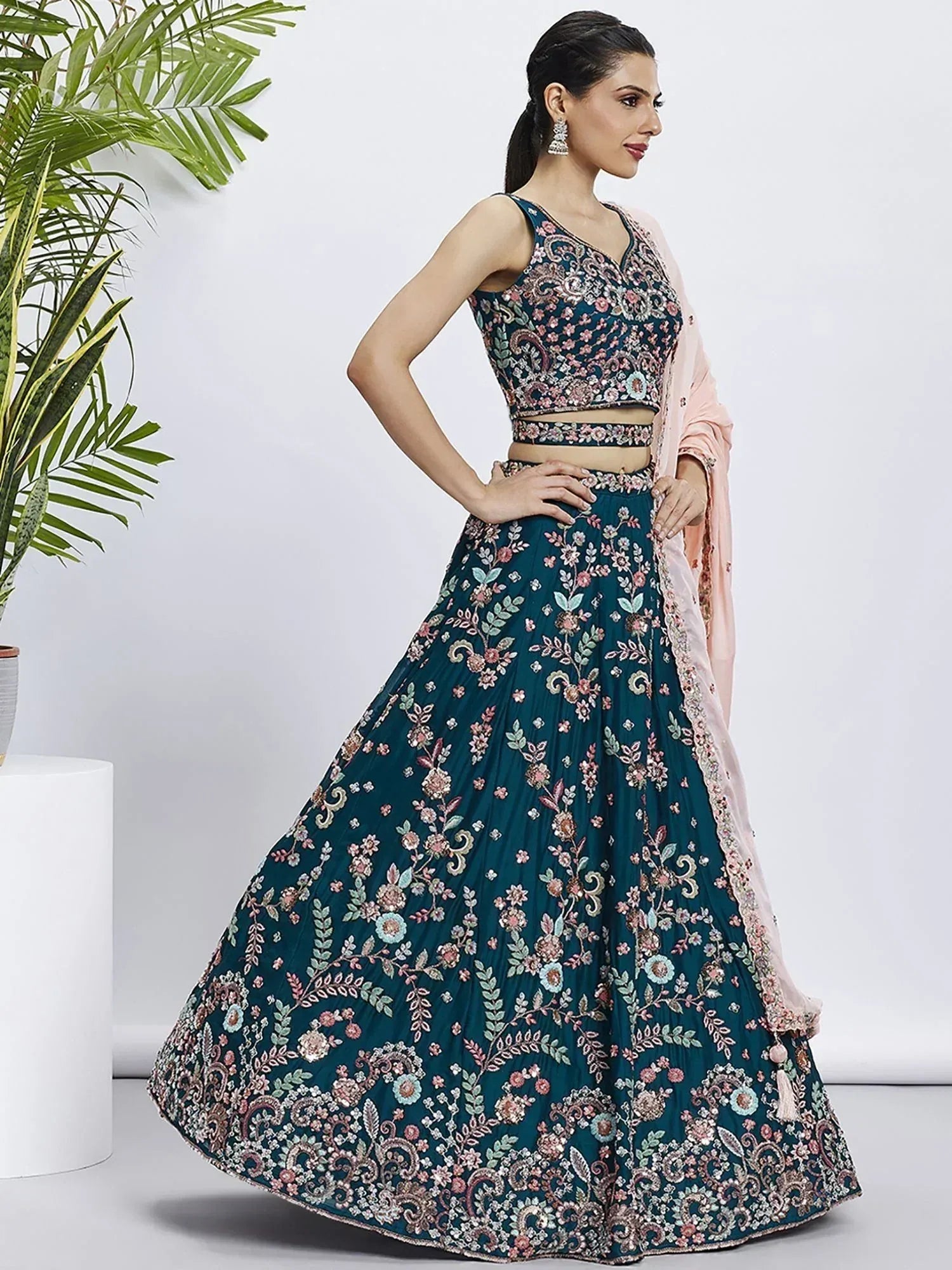 Teal floral embroidered lehenga choli with pink dupatta, perfect for Indian ethnic wear
