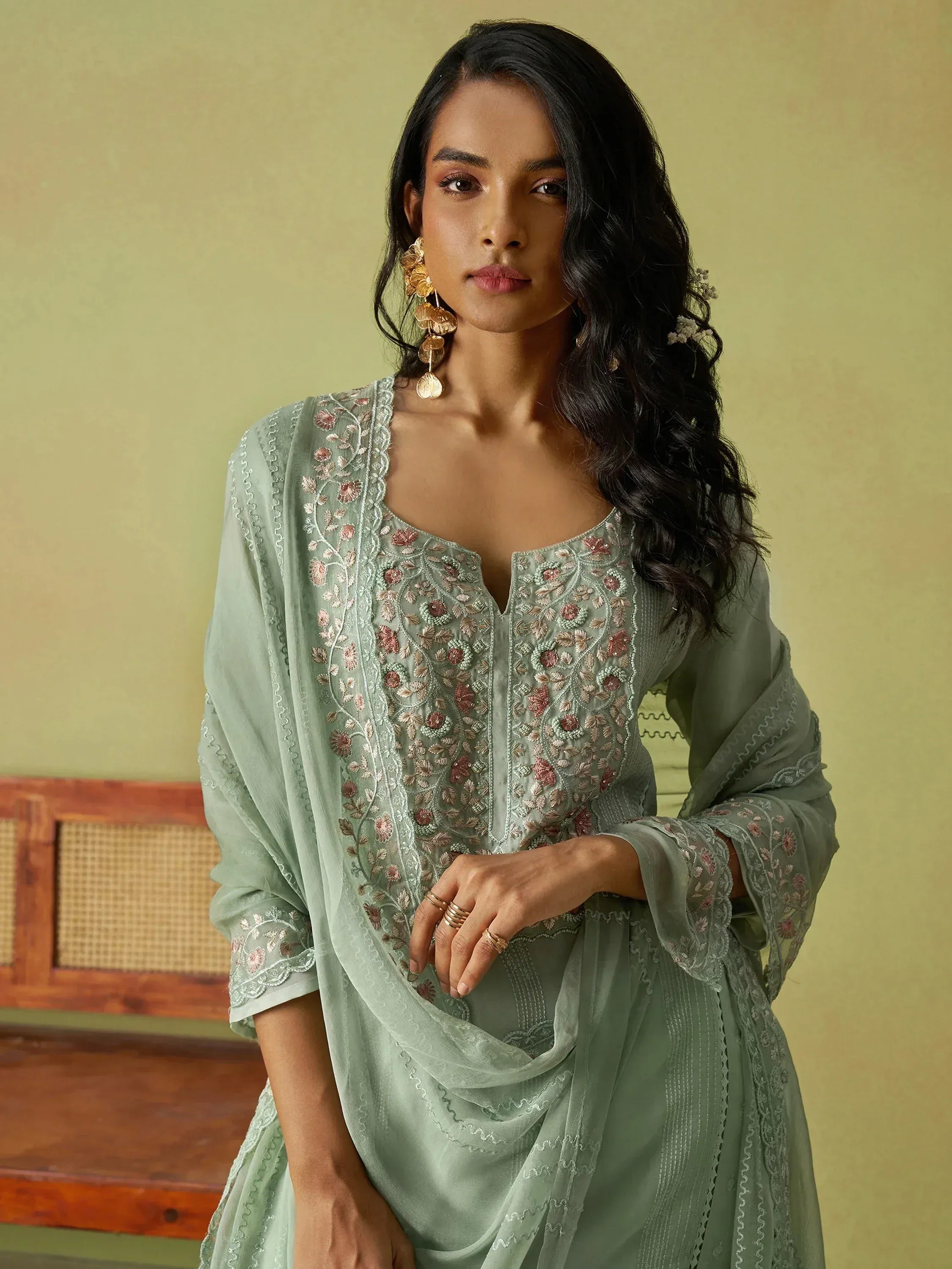 Mint green embroidered salwar kameez with floral detailing, perfect for Indian ethnic wear occasions.