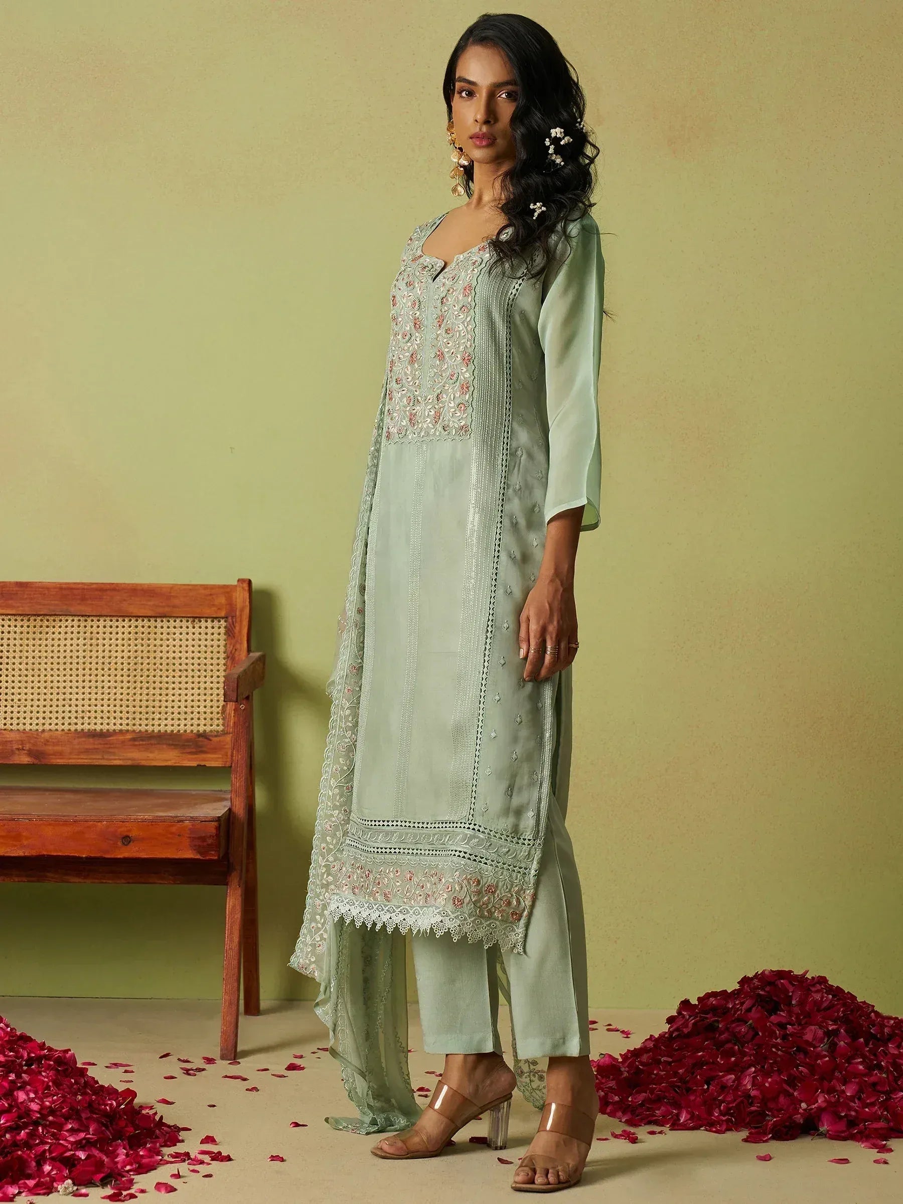 Mint green embroidered salwar kameez with floral detailing, perfect for Indian ethnic wear occasions.