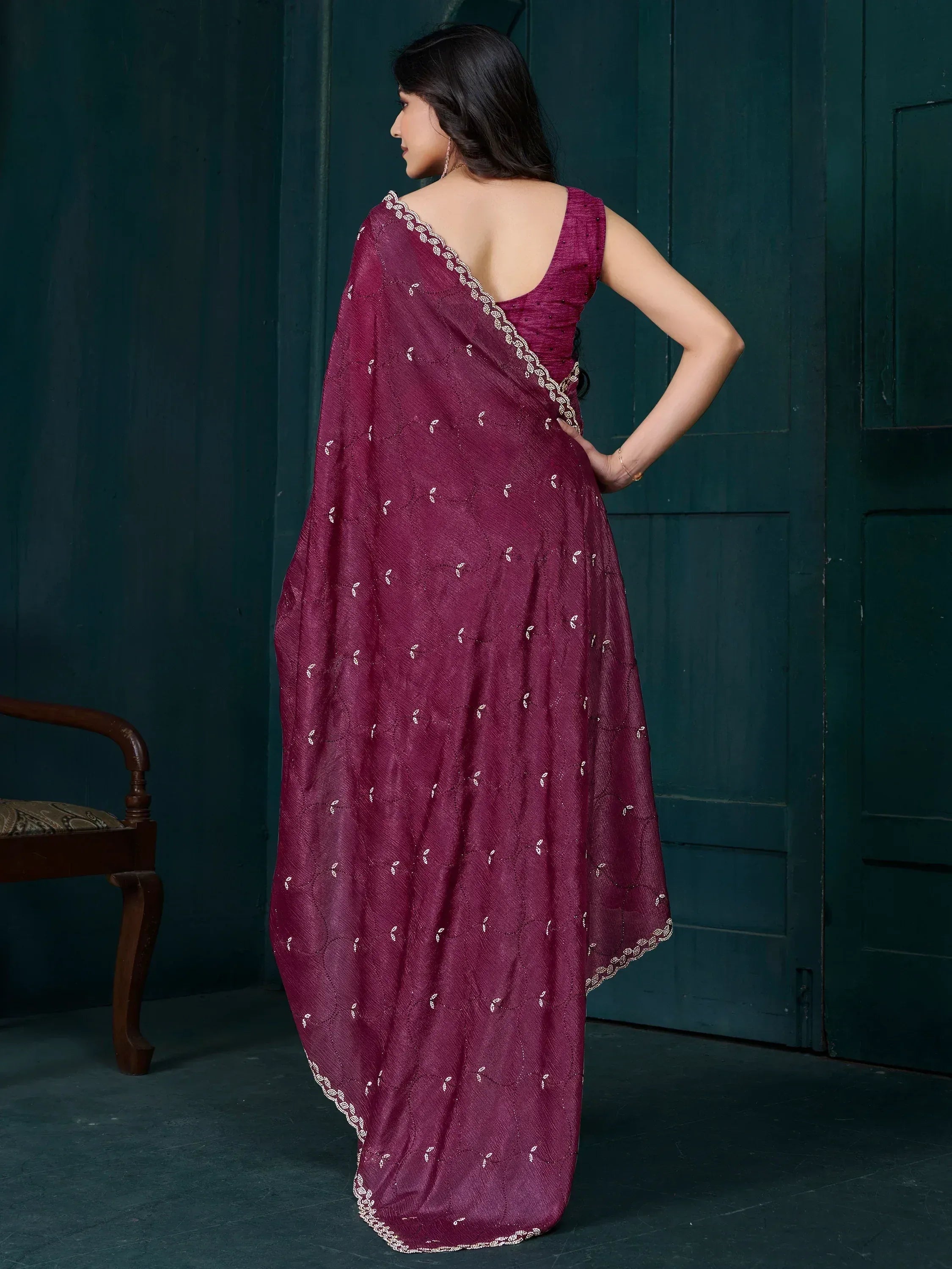 Elegant maroon saree with white embroidery and scalloped border, styled with backless blouse for Indian ethnic wear