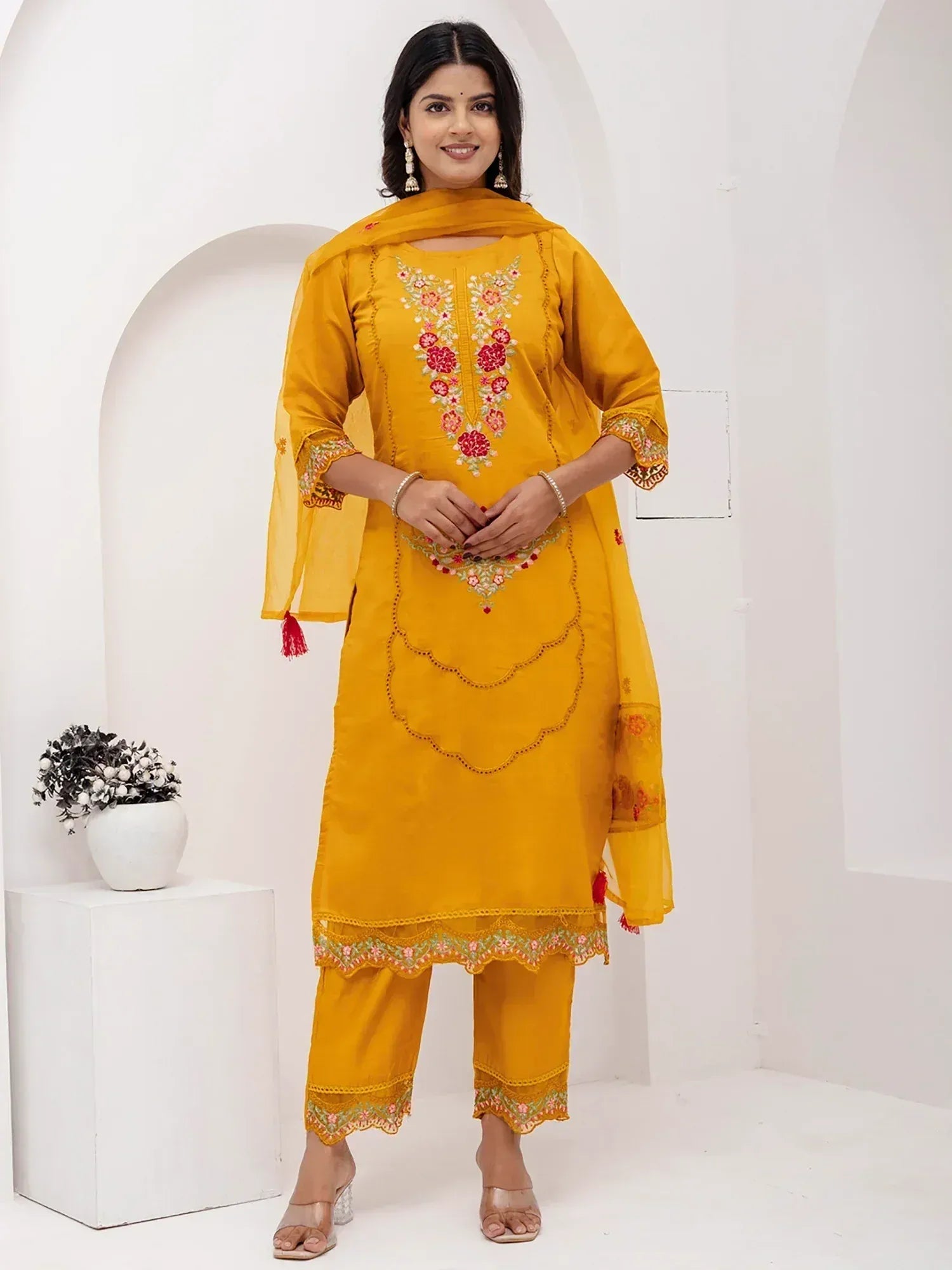 Yellow embroidered salwar kameez with floral design, perfect for ethnic wear and festive occasions