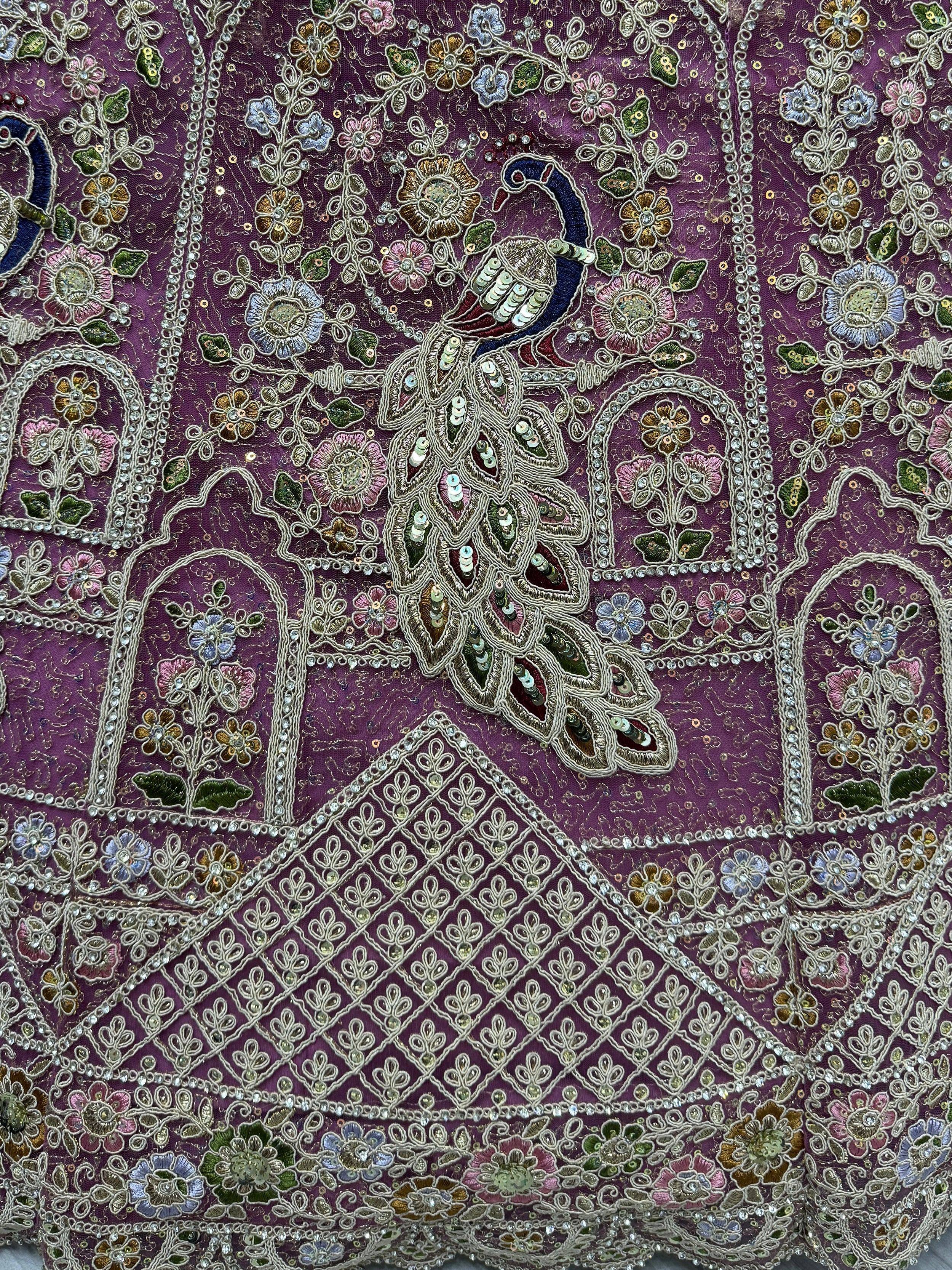 Purple ethnic wear with peacock embroidery, floral motifs, and sequin detailing for lehenga or saree
