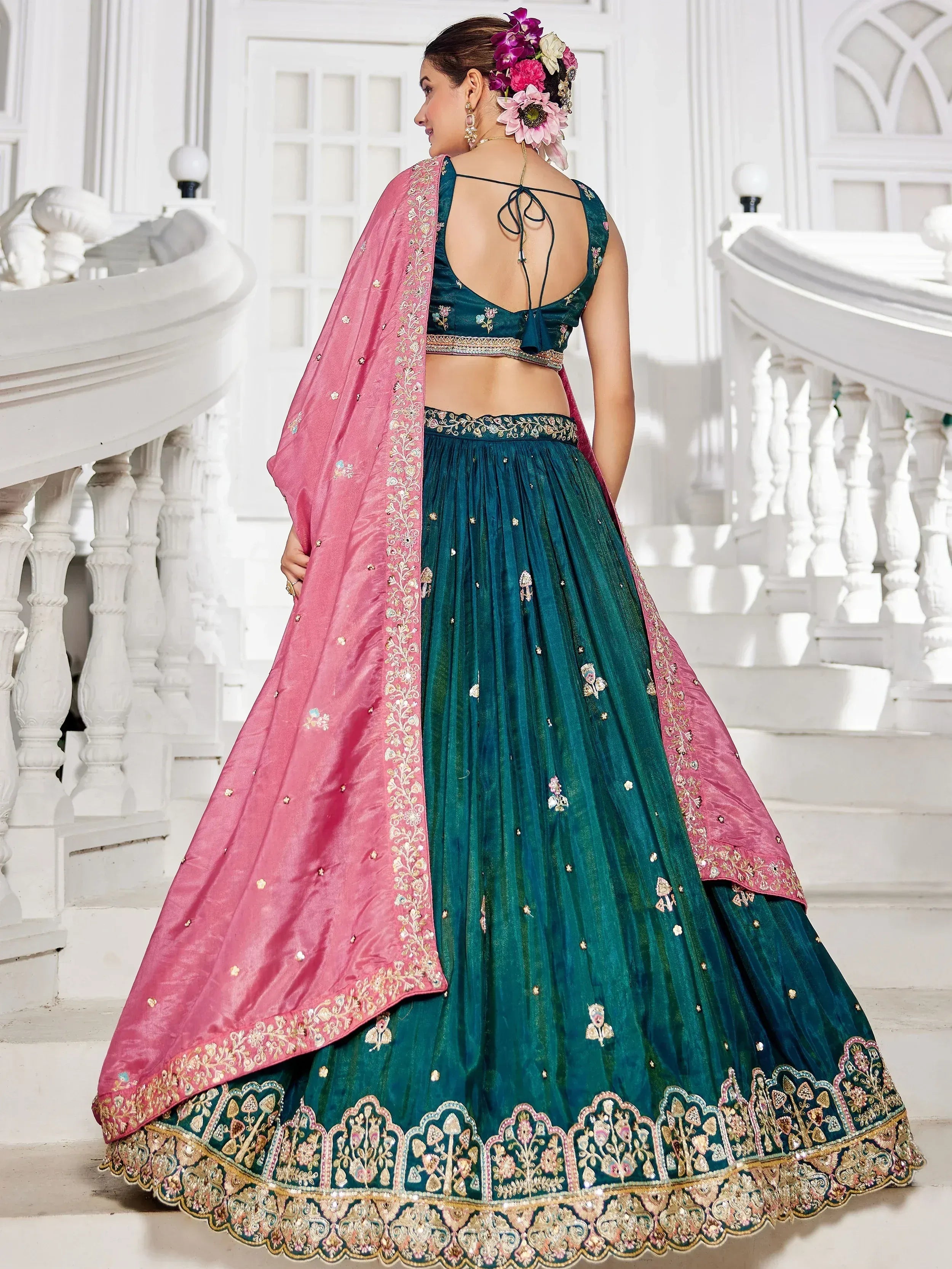 Teal lehenga choli with pink dupatta, floral embroidery, and back tie blouse for Indian ethnic wear
