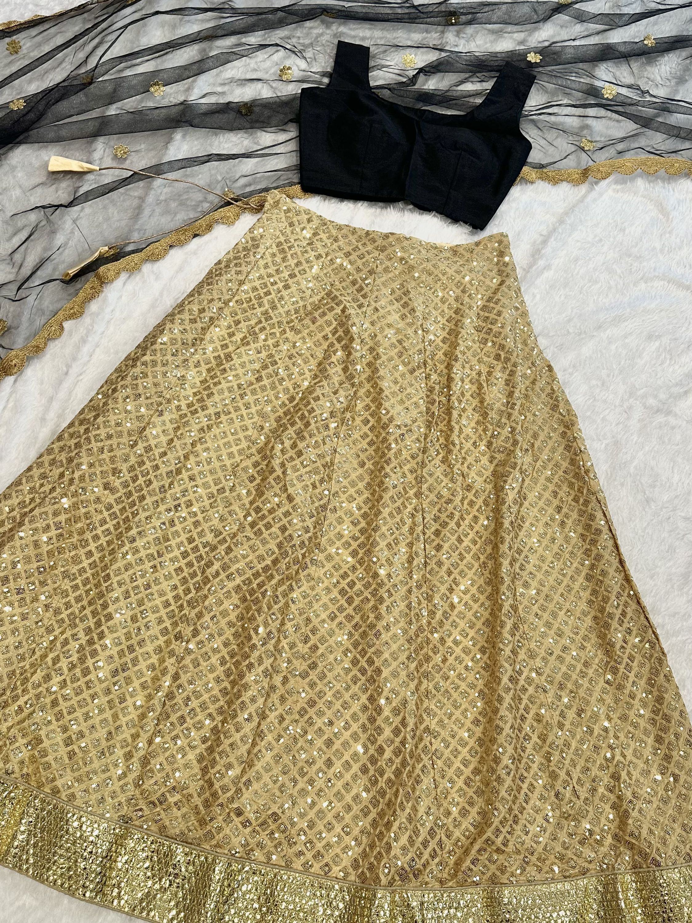 Gold sequin lehenga with black blouse and sheer dupatta, ethnic Indian wear