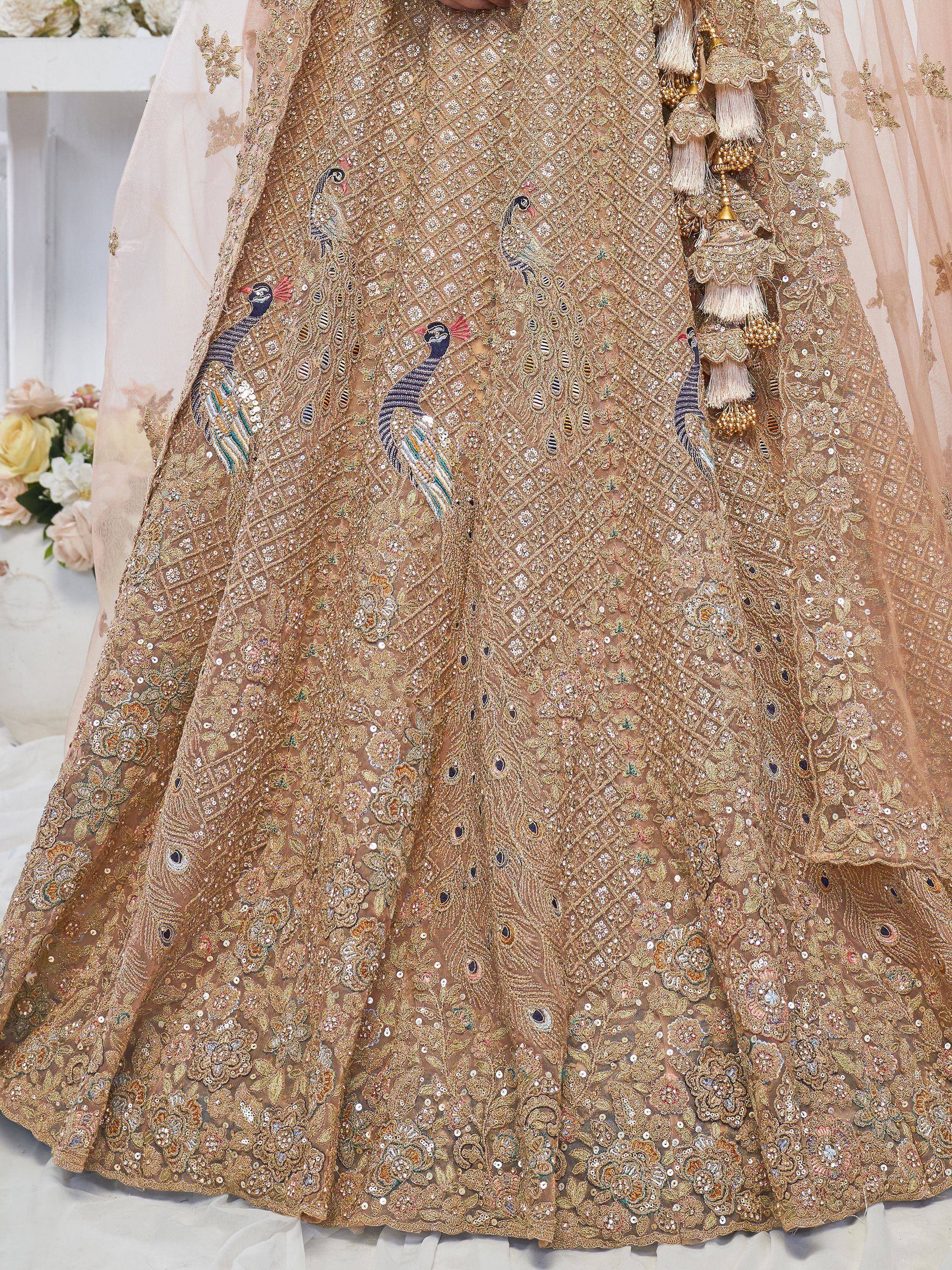 Gold embroidered lehenga with peacock motifs and sequin detailing, perfect for Indian weddings