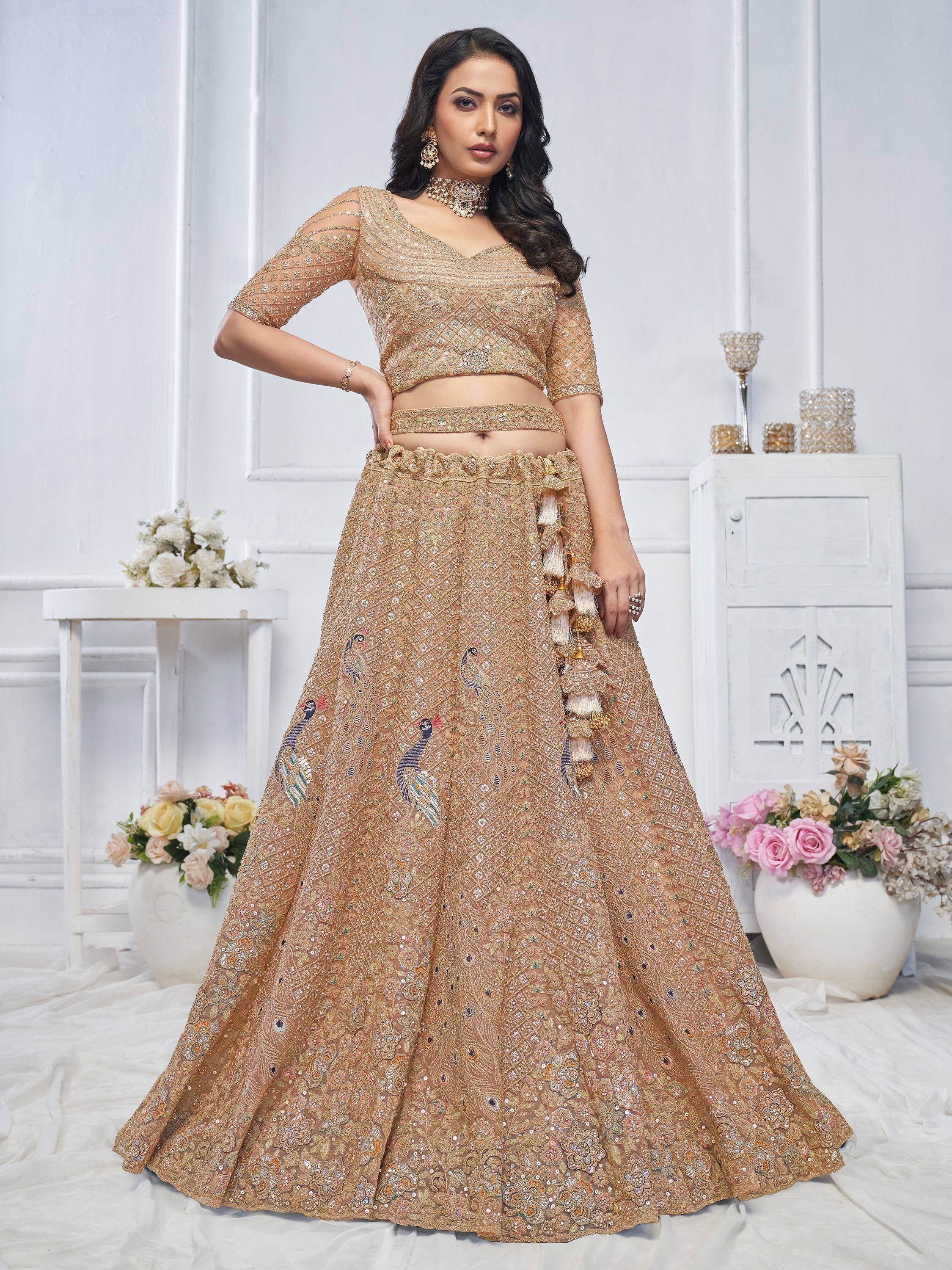 Gold embroidered lehenga choli with peacock motifs, perfect for Indian weddings and festive occasions