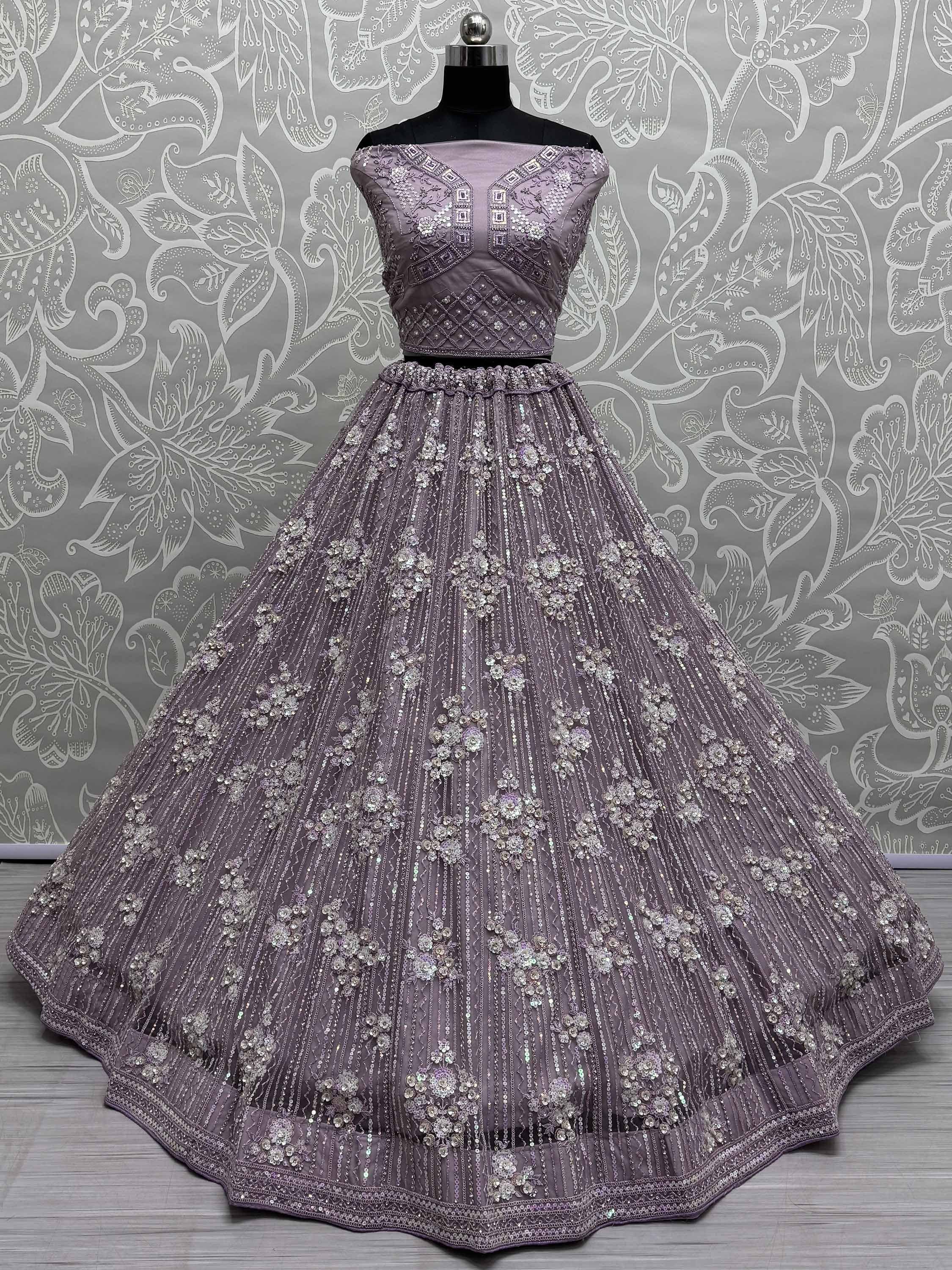 Lavender designer lehenga choli with heavy floral embroidery and sequin work, perfect for weddings and parties.