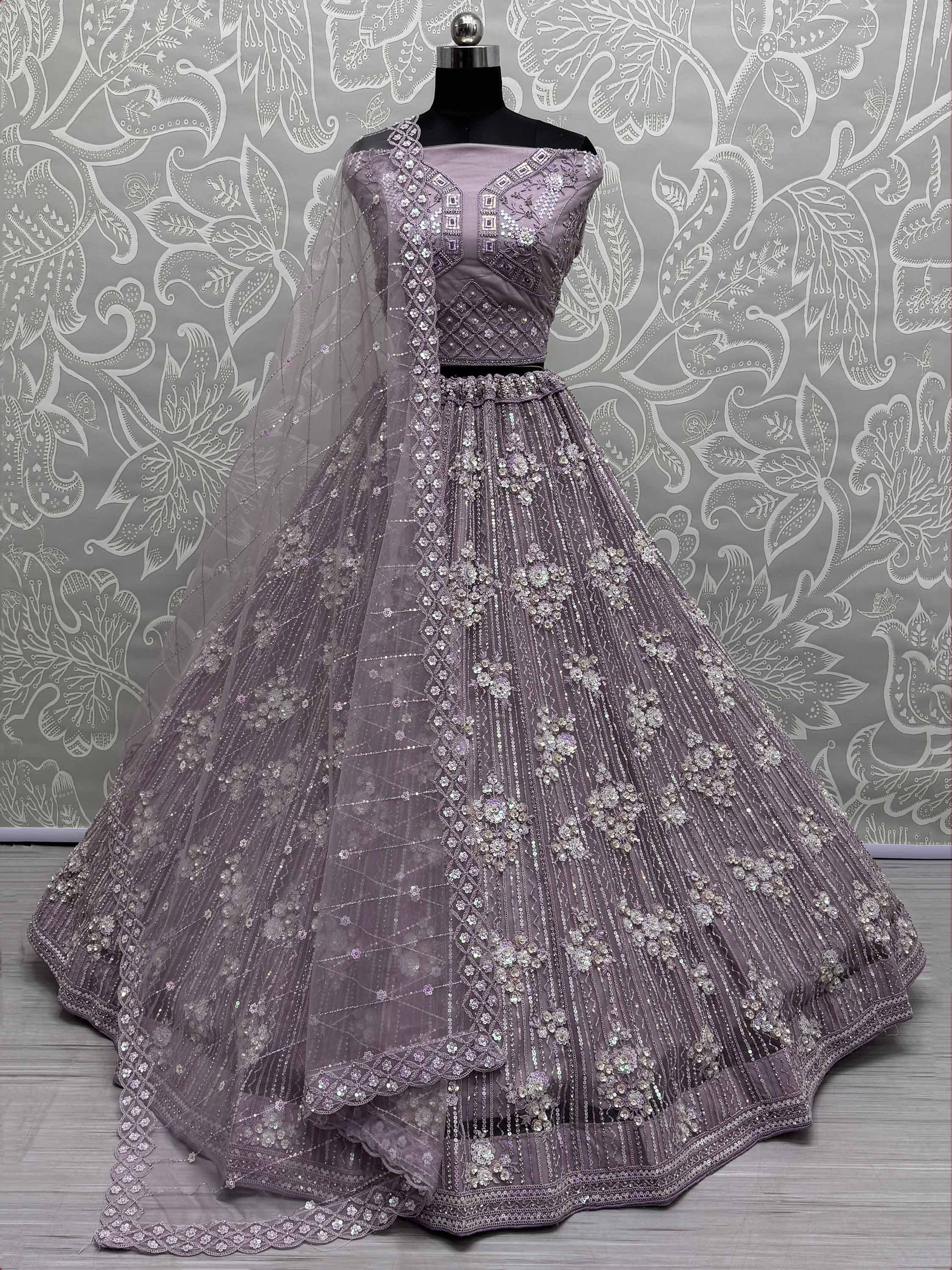 Lavender designer lehenga choli with heavy sequin embroidery and sheer dupatta, perfect for Indian weddings.
