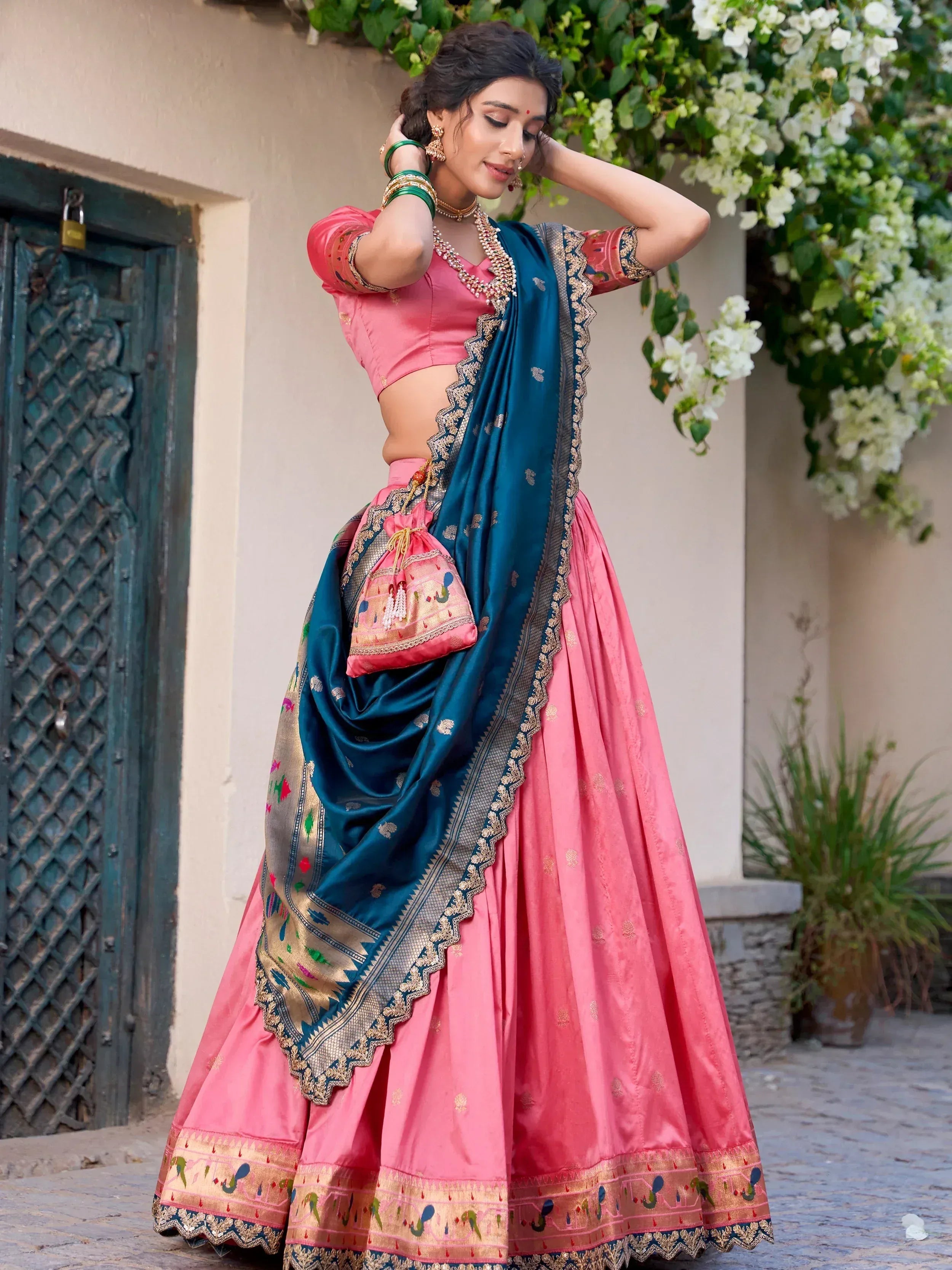 Pink and teal designer lehenga choli with embroidered dupatta, perfect for Indian ethnic wear occasions
