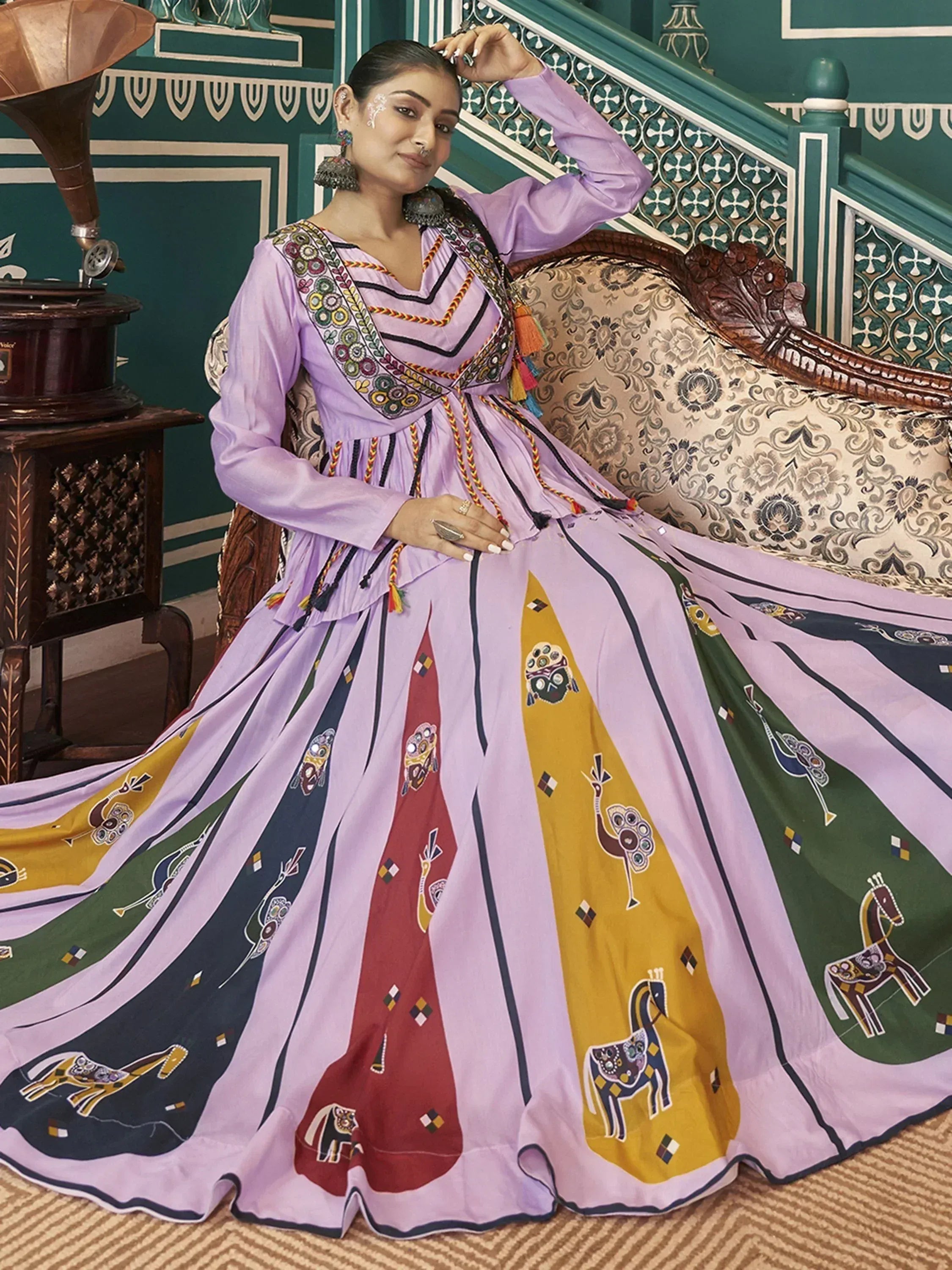 Purple ethnic gown with colorful animal prints and embroidery, perfect for Indian festive occasions.