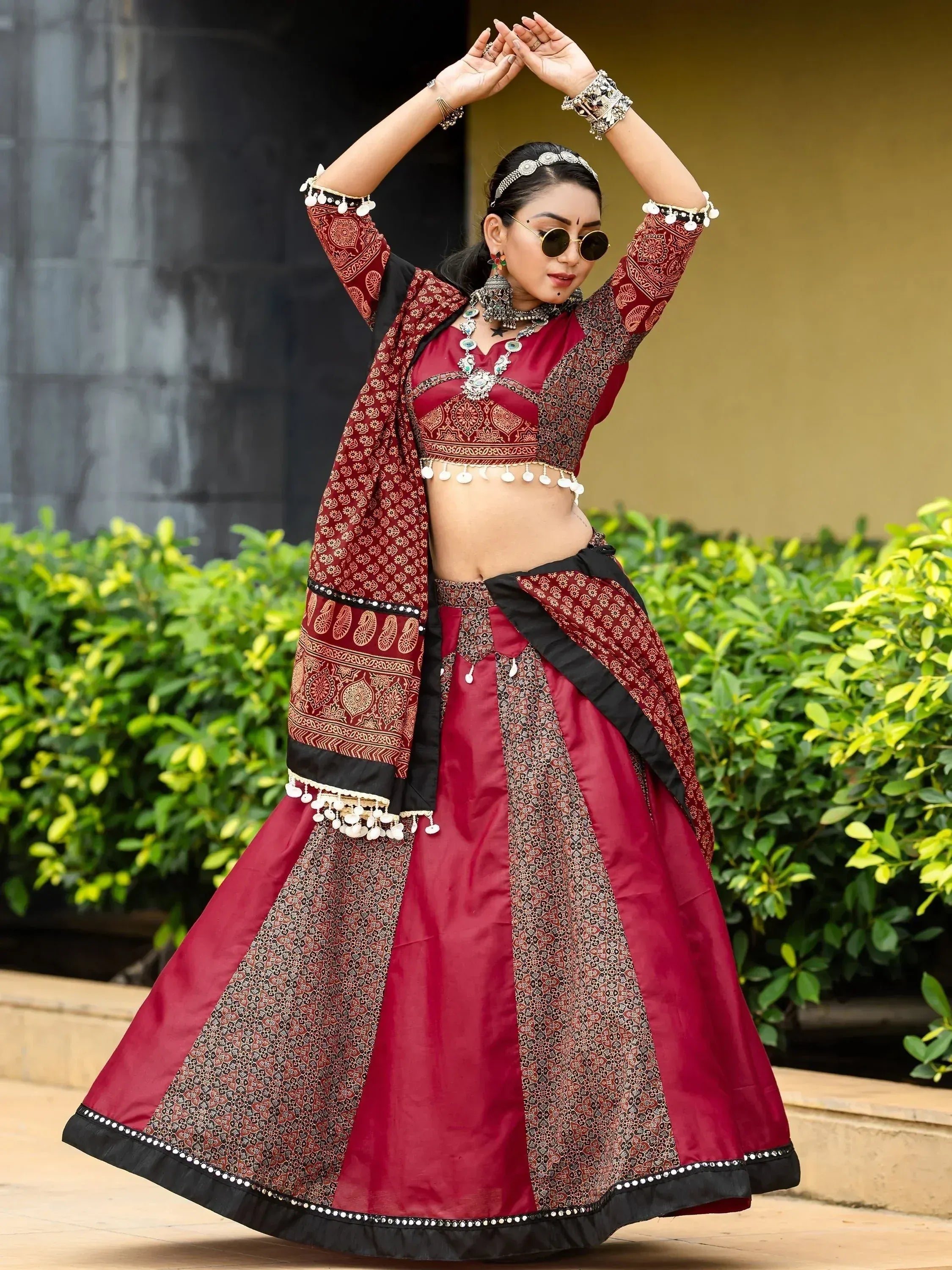 Maroon and black printed lehenga choli with mirror work, perfect for Indian ethnic wear events