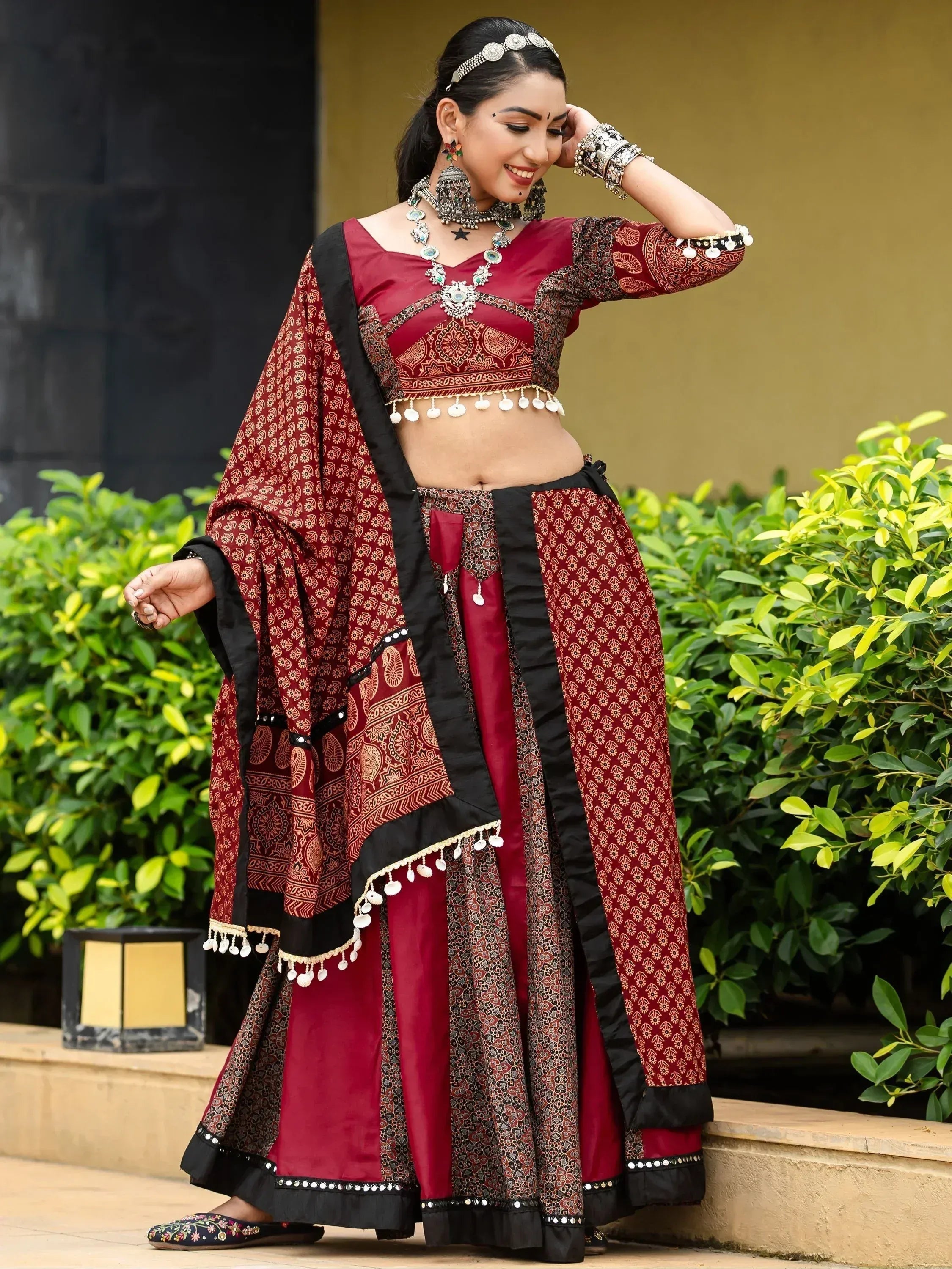 Maroon and black printed lehenga choli with mirror work, perfect for Indian ethnic occasions