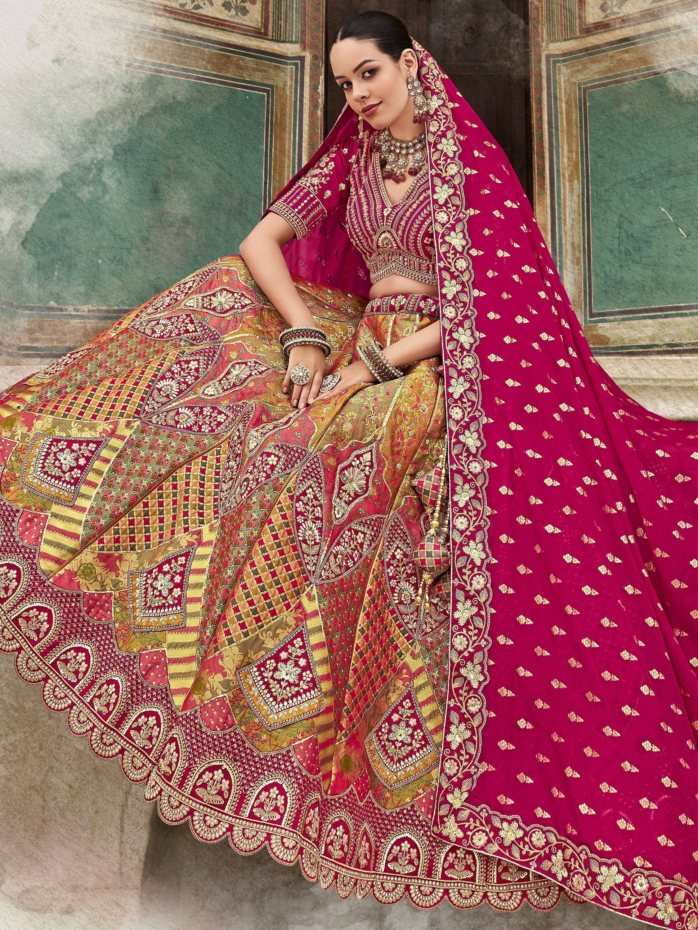 Elegant magenta lehenga choli with gold embroidery, perfect for Indian weddings and festive occasions.