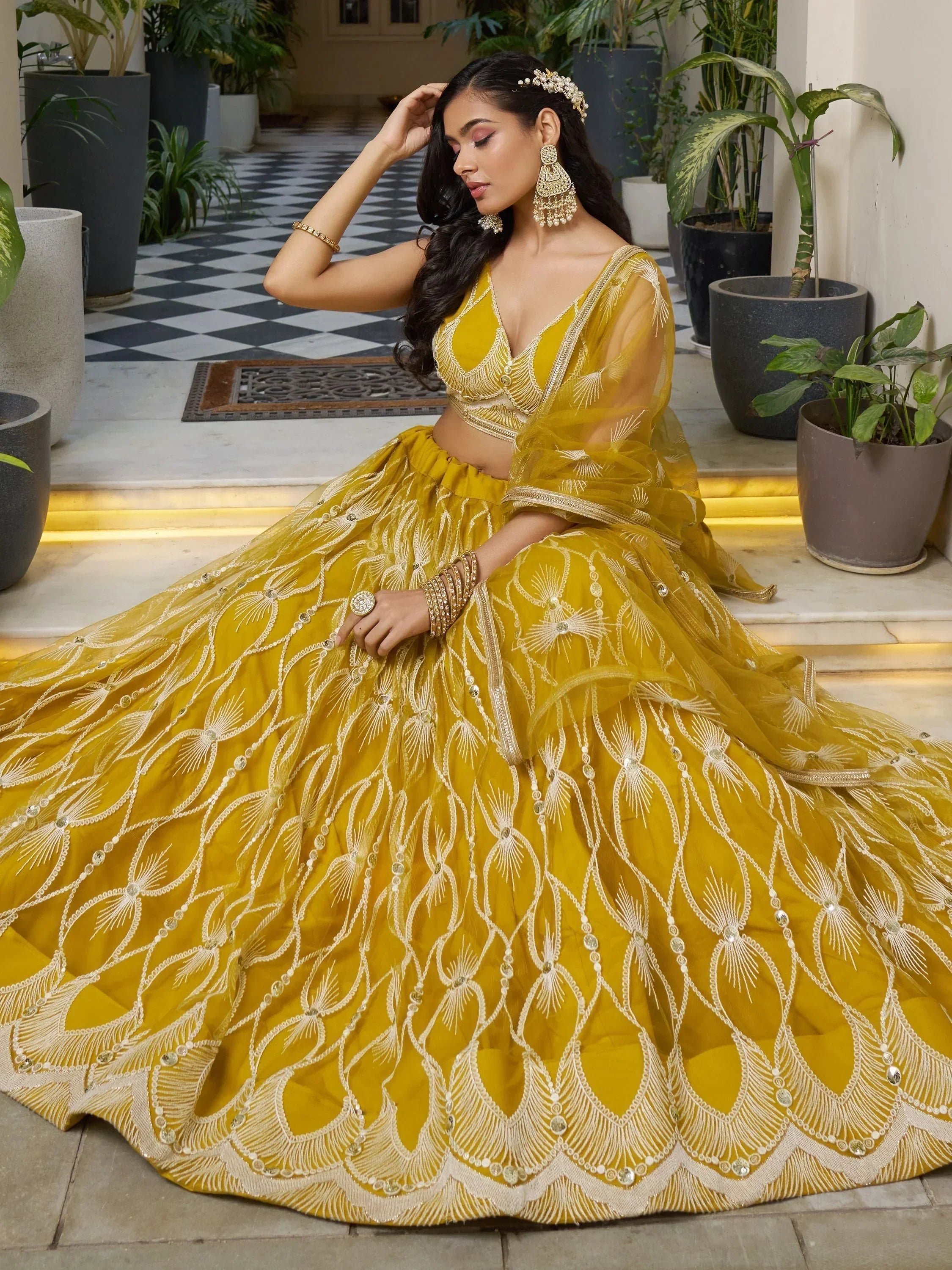 Mustard yellow designer lehenga choli with gold embroidery, perfect for weddings and festive occasions