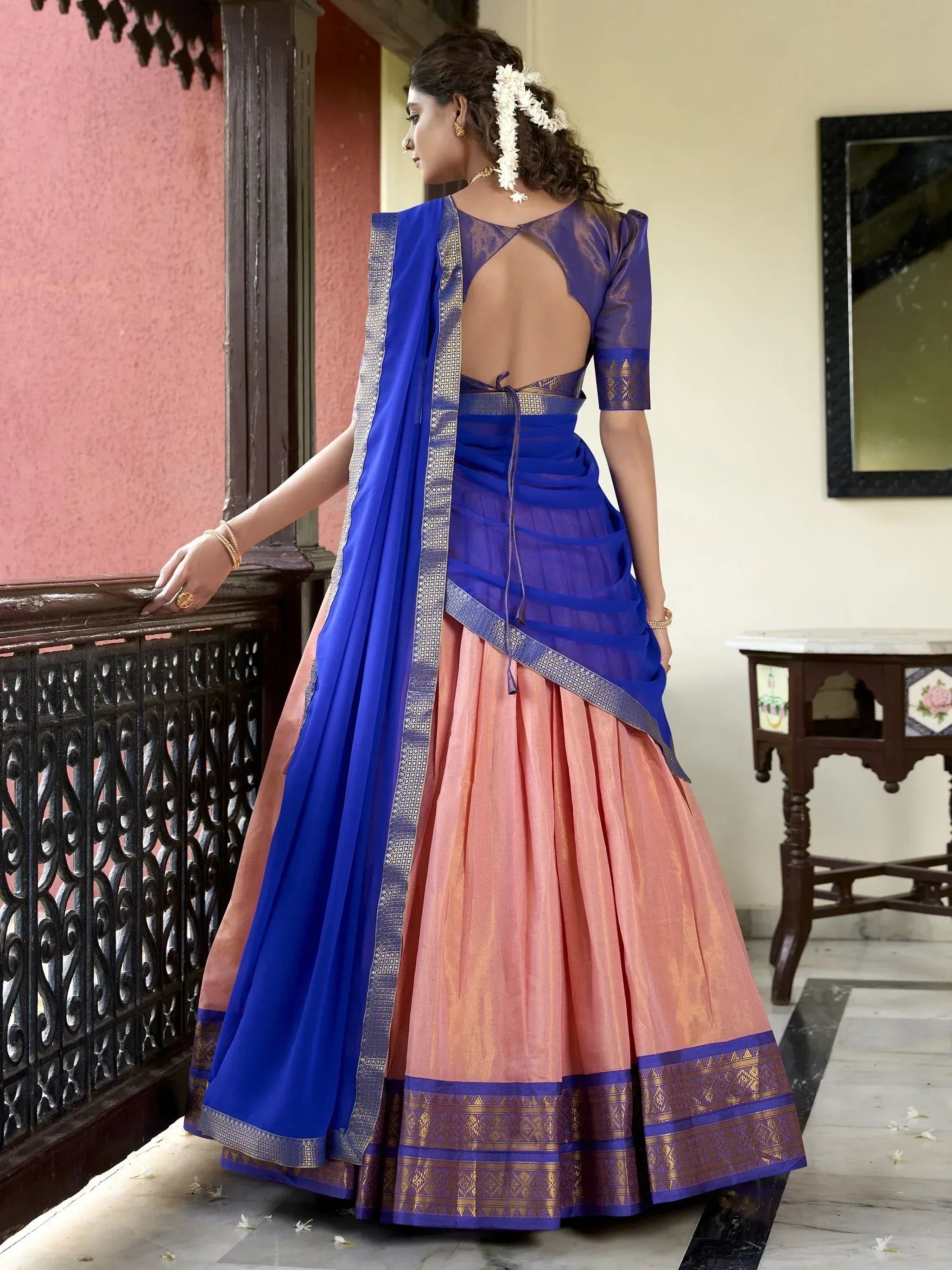 Blue and peach designer lehenga choli with backless blouse and gold border, ethnic Indian wear