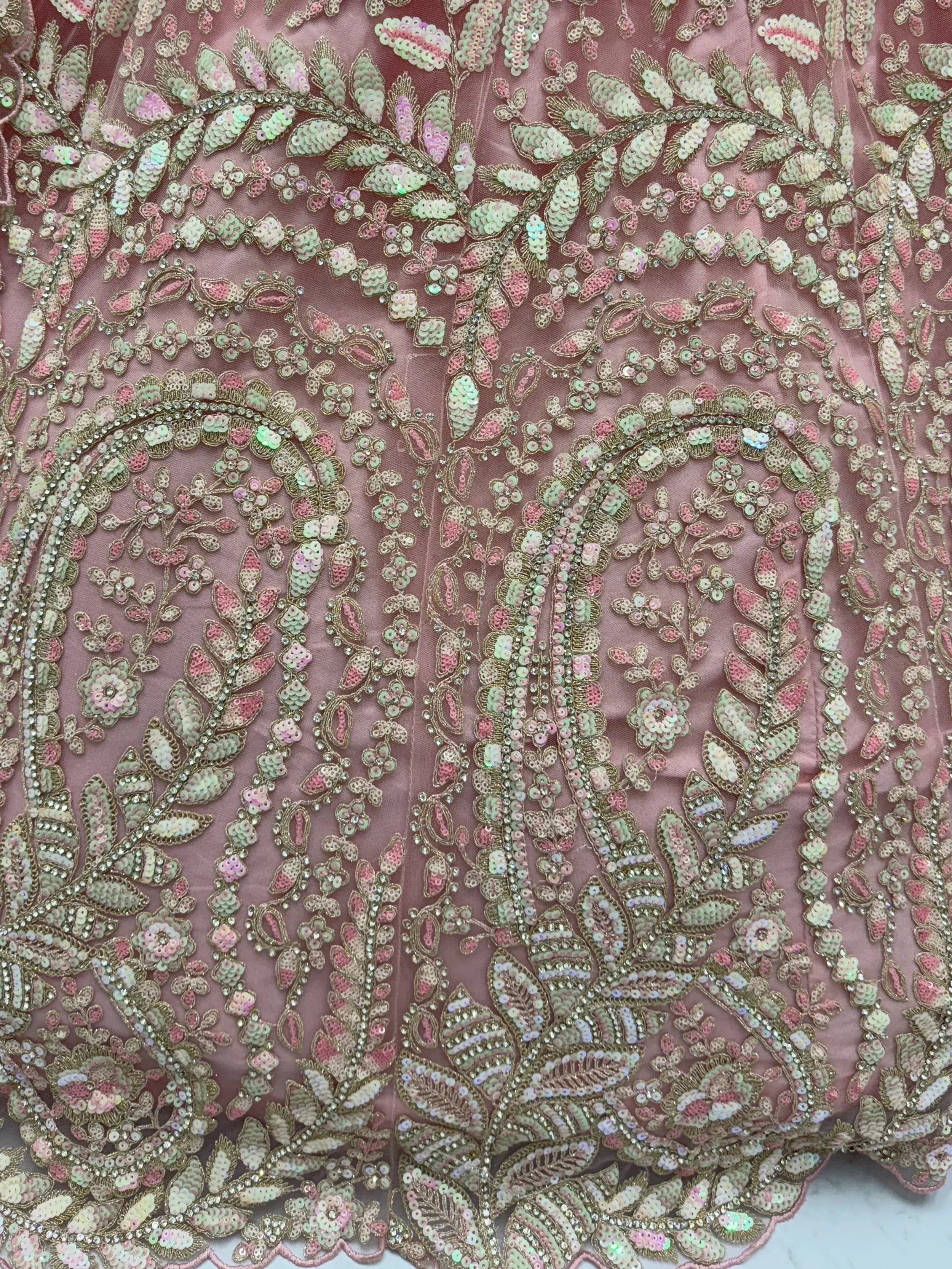 Pink ethnic gown with intricate floral sequin and bead embroidery, perfect for Indian weddings or festive occasions.