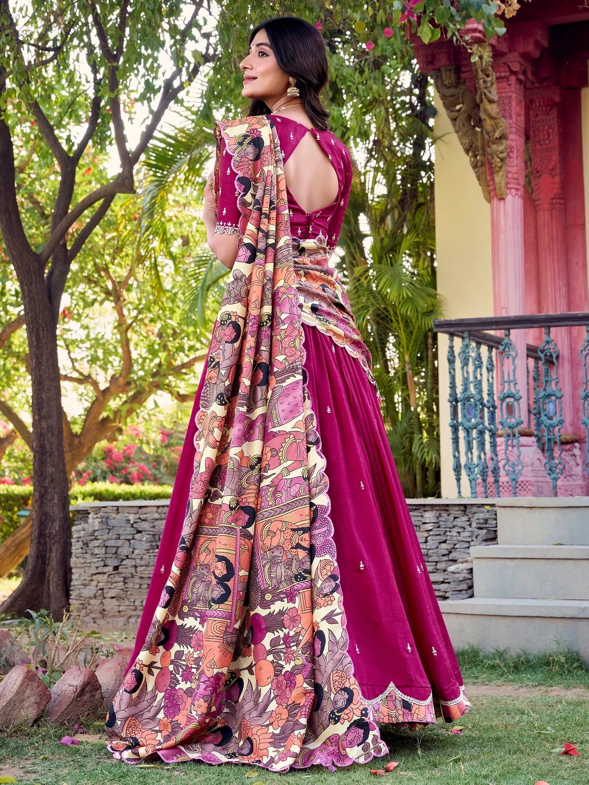Woman in maroon designer lehenga choli with printed dupatta, perfect for Indian ethnic wear occasions