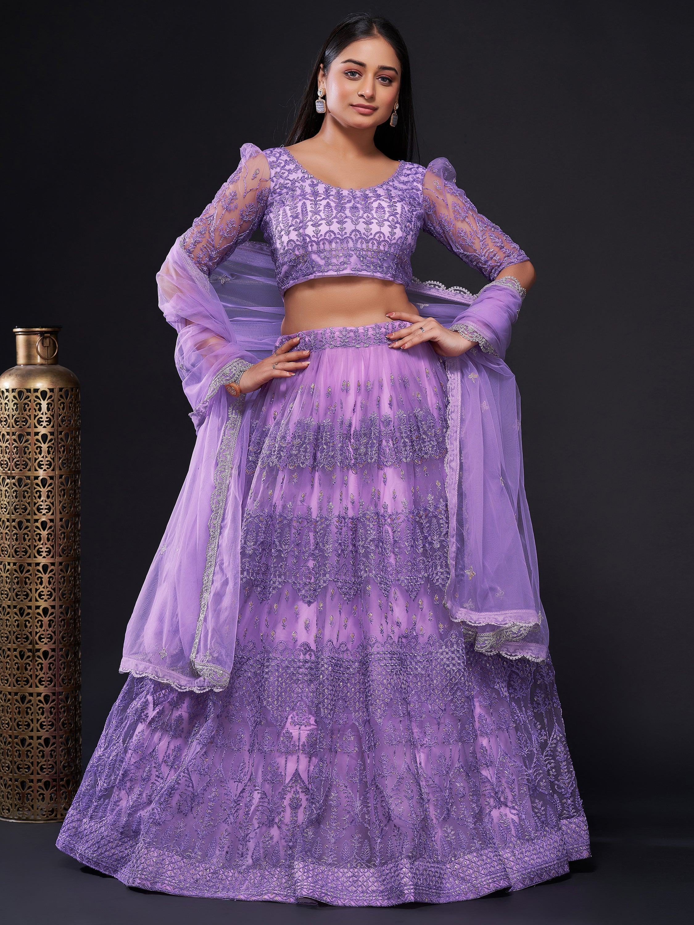 Lavender designer lehenga choli with intricate embroidery and sheer sleeves, perfect for Indian ethnic wear occasions.