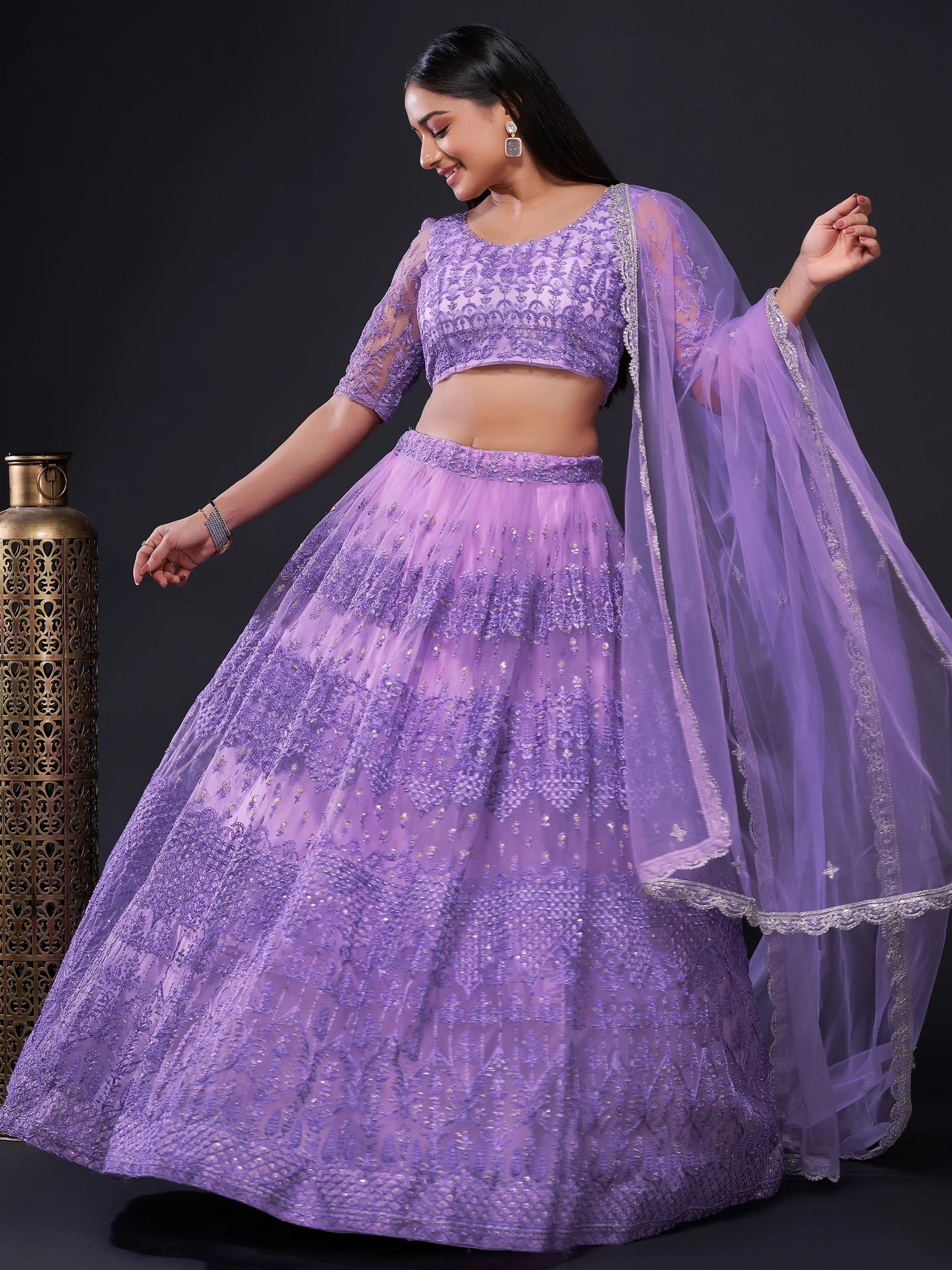 Lavender designer lehenga choli with intricate embroidery and sheer dupatta for Indian ethnic wear
