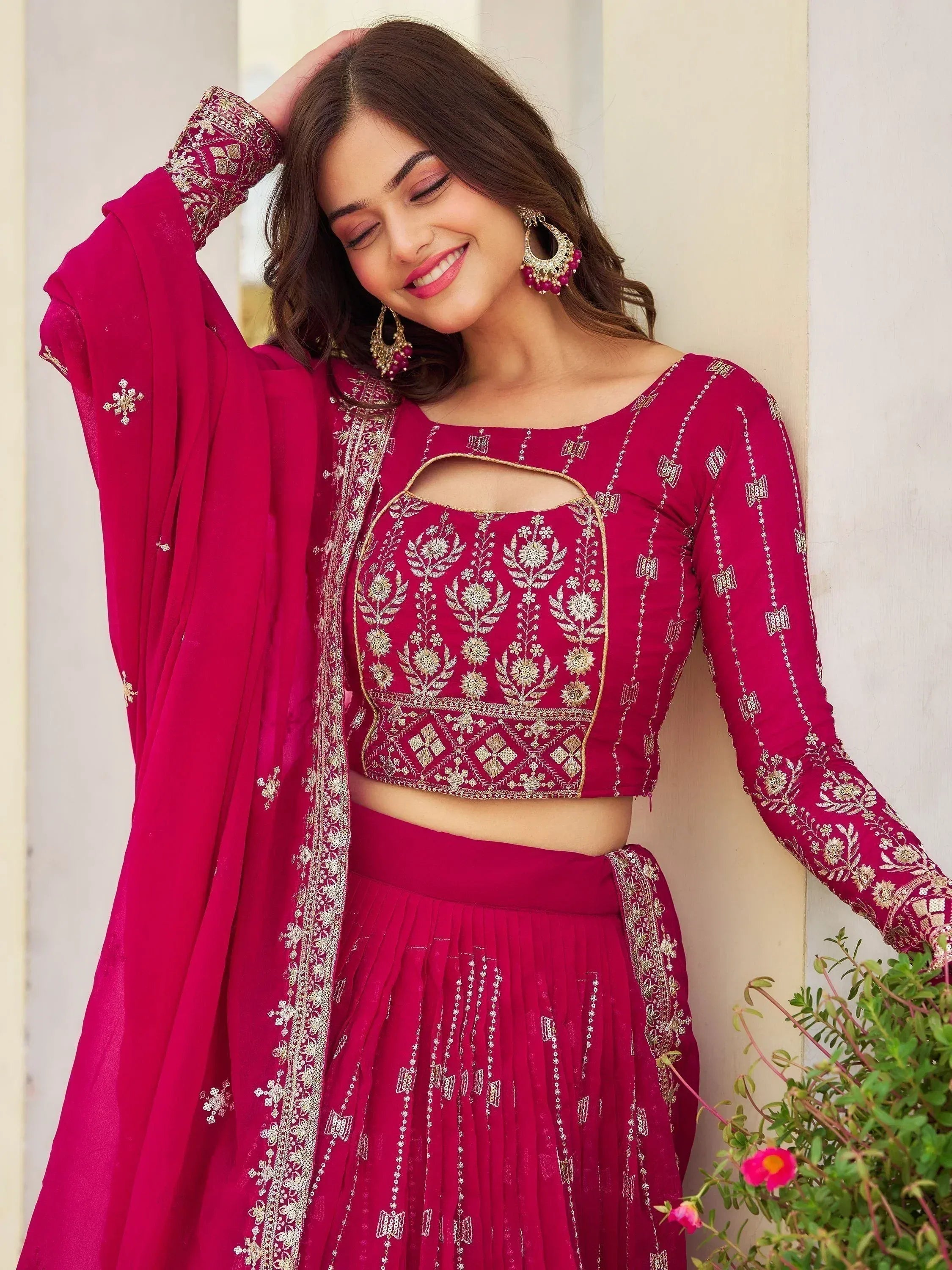 Elegant magenta lehenga choli with gold embroidery, perfect for Indian ethnic wear and festive occasions.