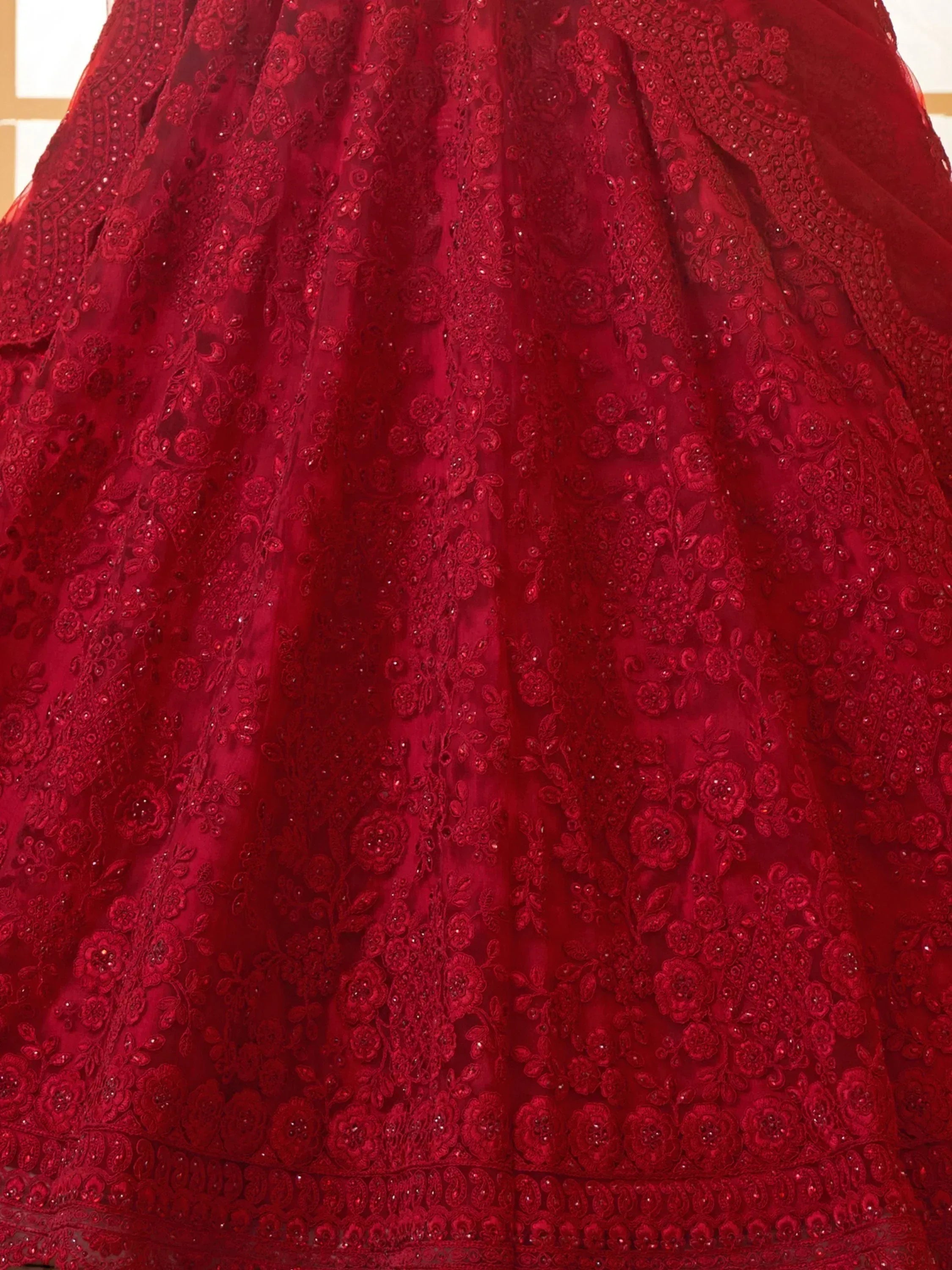 Red embroidered lehenga skirt with floral lace and beadwork, ideal for Indian ethnic wear occasions