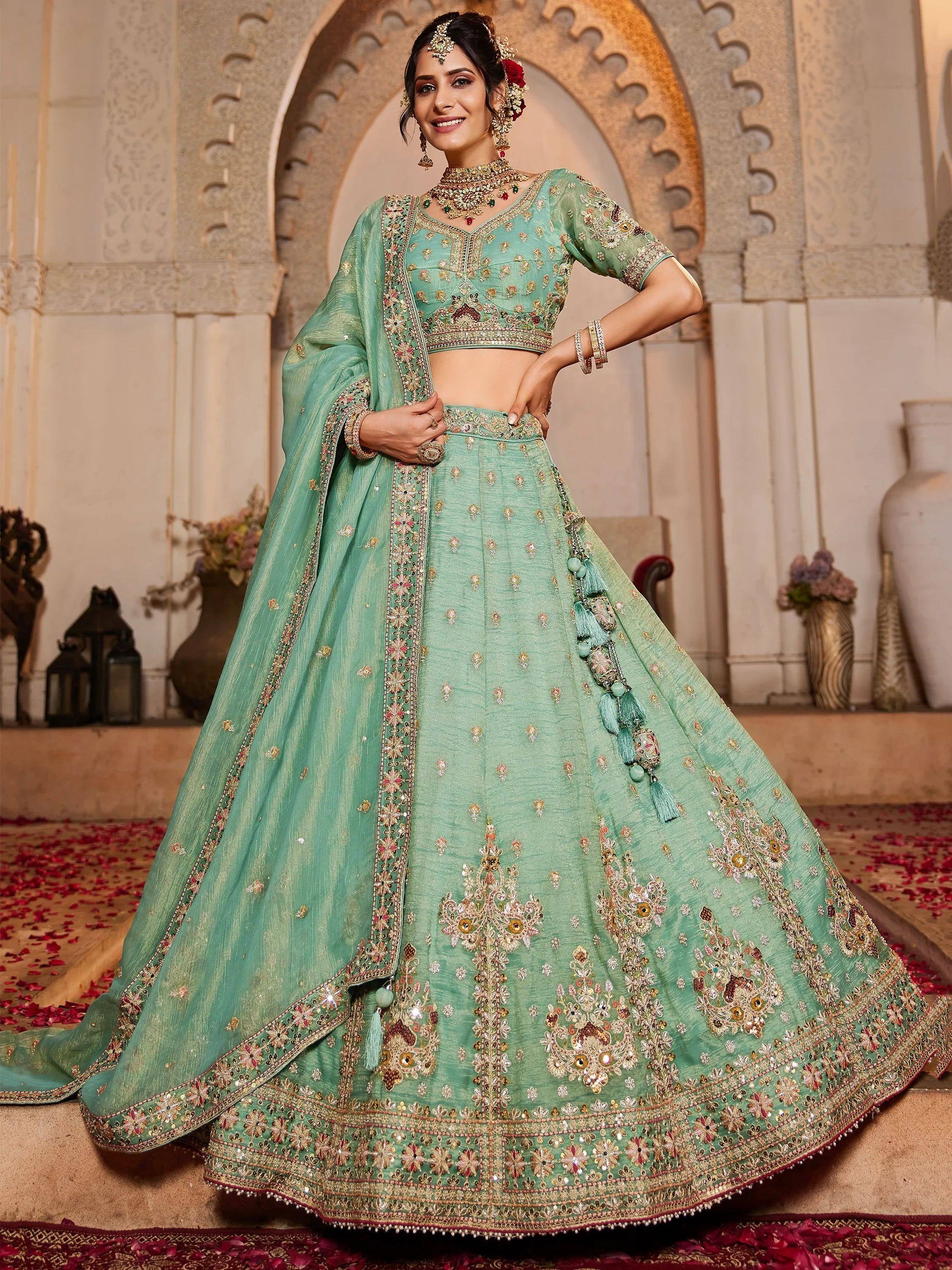 Mint green designer lehenga choli with heavy embroidery, perfect for Indian weddings and festive occasions