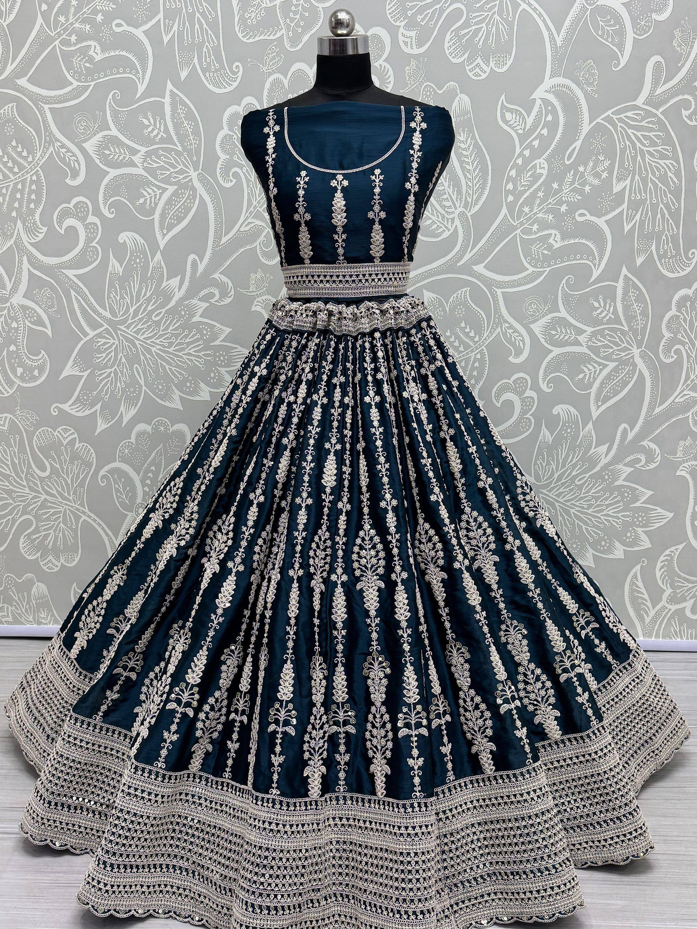 Dark blue designer lehenga choli with intricate silver embroidery and flared skirt, perfect for Indian ethnic occasions.
