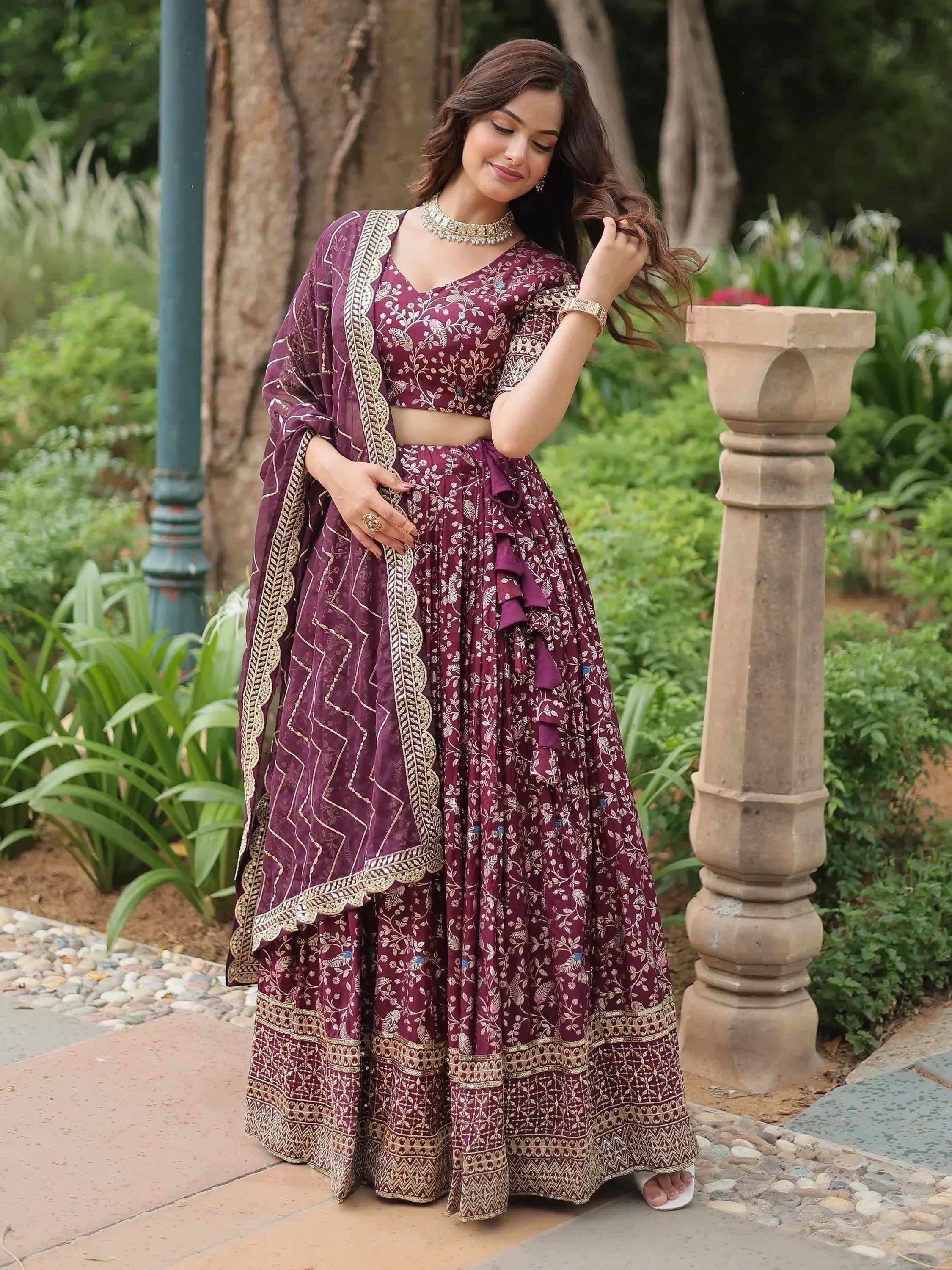 Elegant maroon lehenga choli with gold embroidery, perfect for Indian ethnic wear occasions