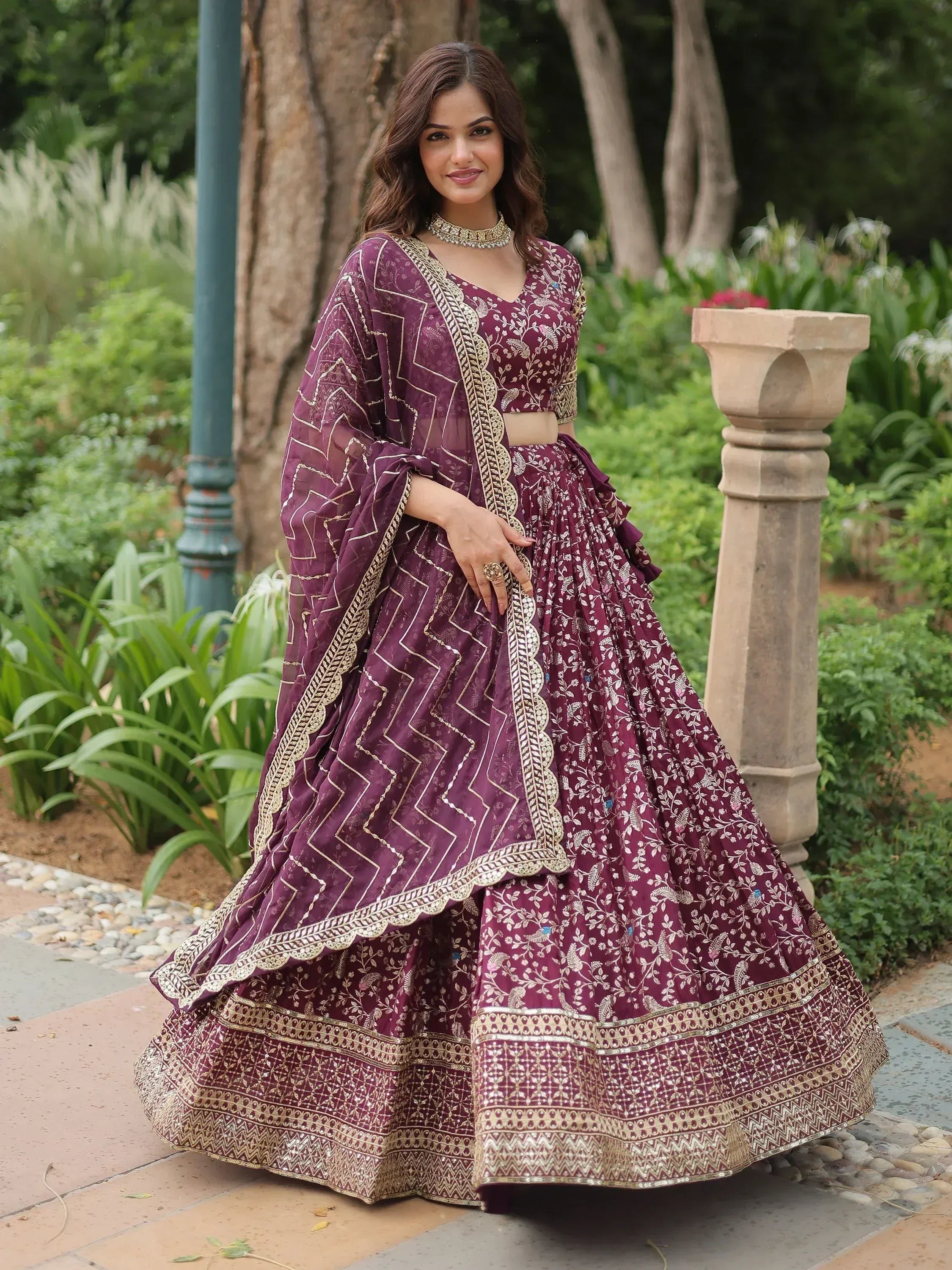 Elegant maroon lehenga choli with gold embroidery, perfect for Indian ethnic wear occasions.