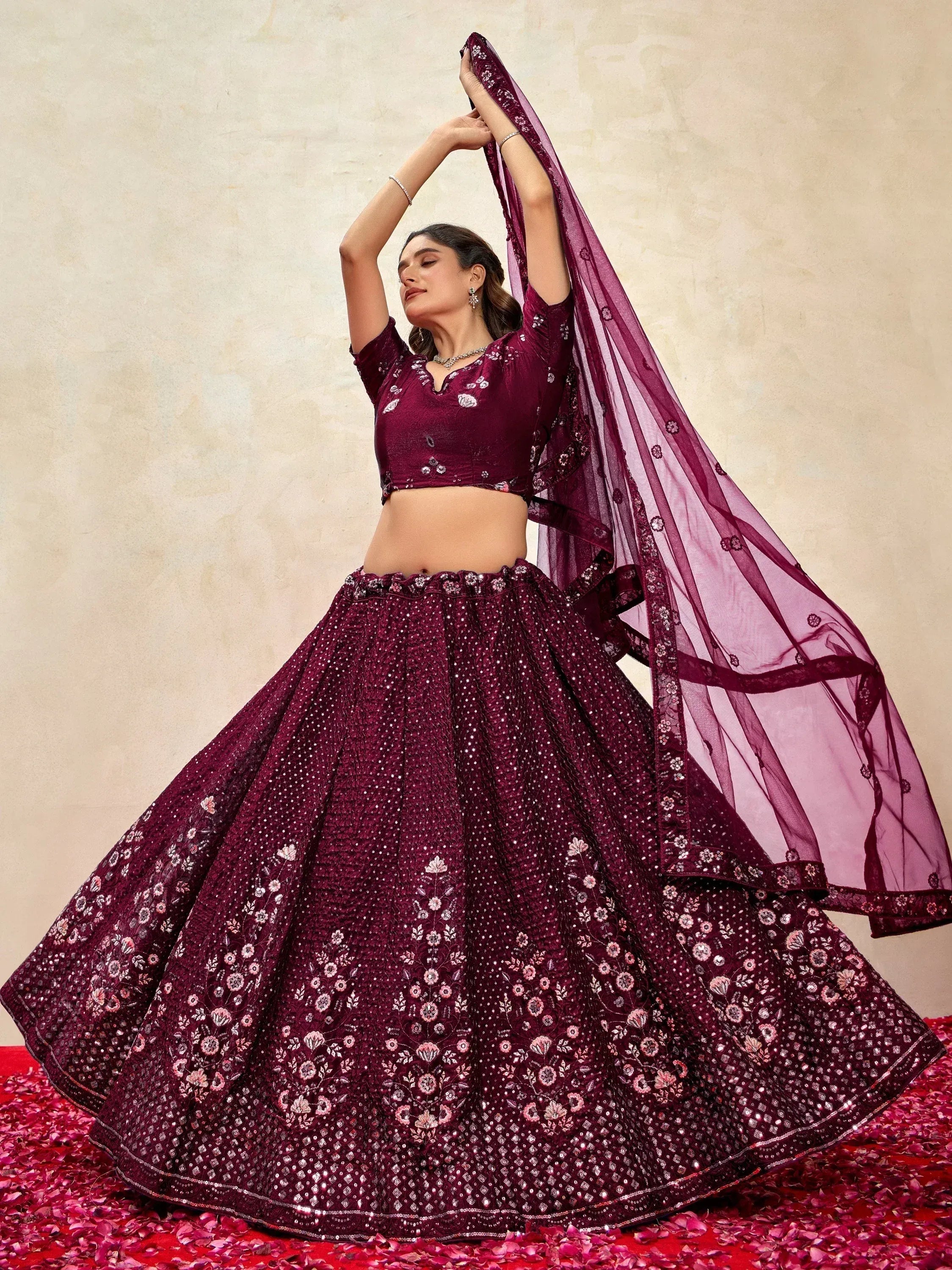 Elegant maroon lehenga choli with floral embroidery and sequins, perfect for Indian ethnic wear occasions
