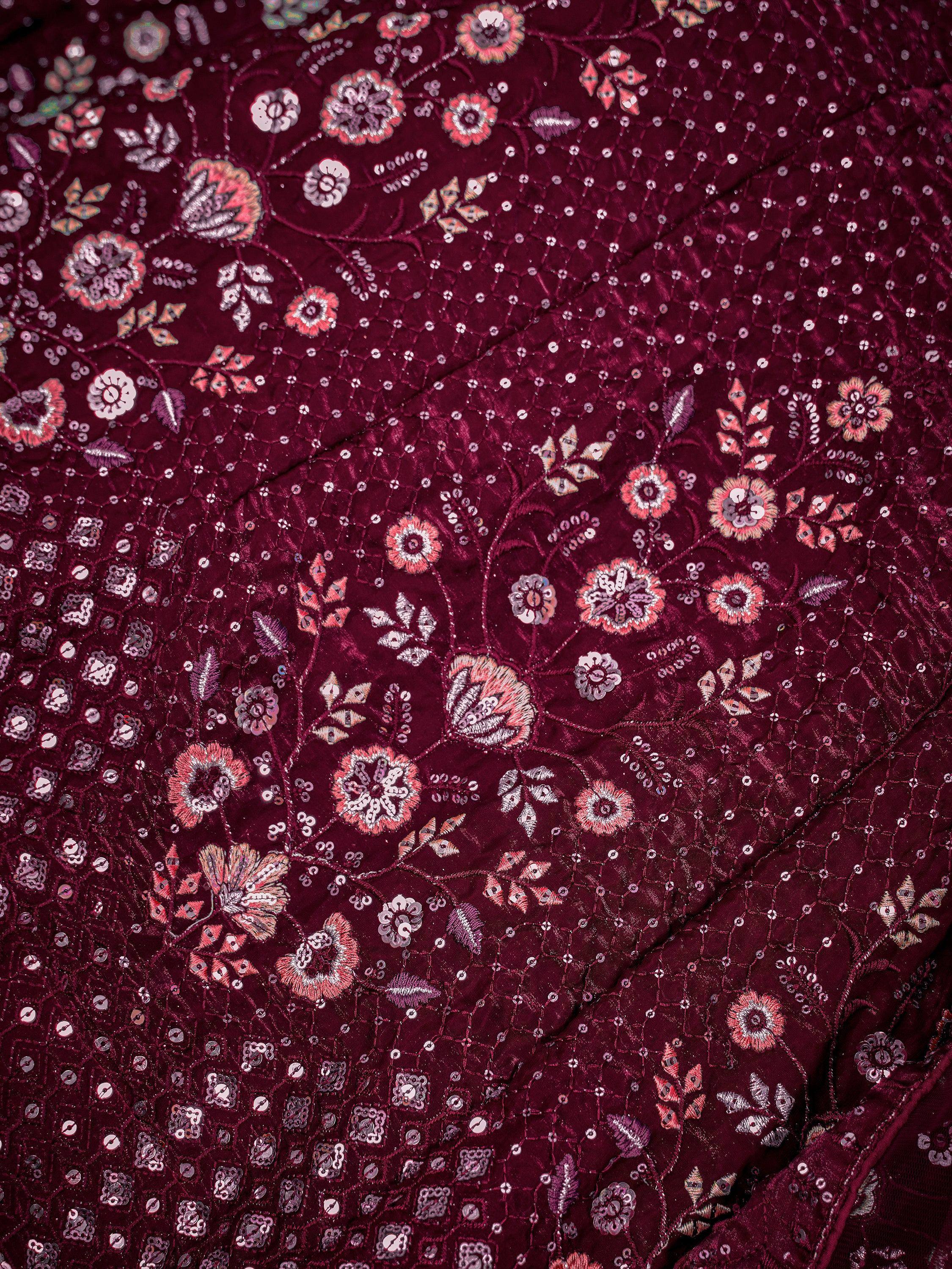 Rich maroon ethnic wear fabric with floral embroidery and sequin detailing for designer lehenga or saree