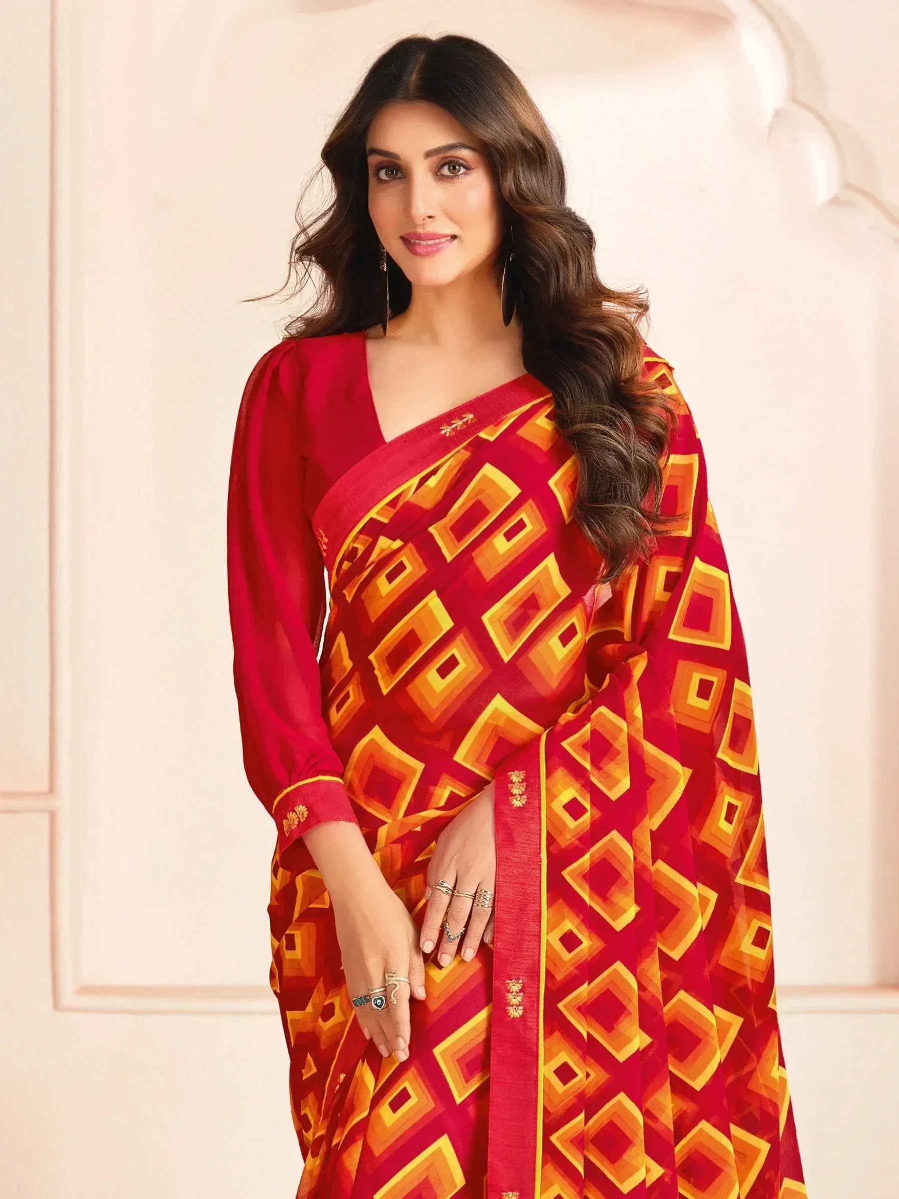 Woman in red and gold geometric print saree with matching blouse, ethnic Indian wear