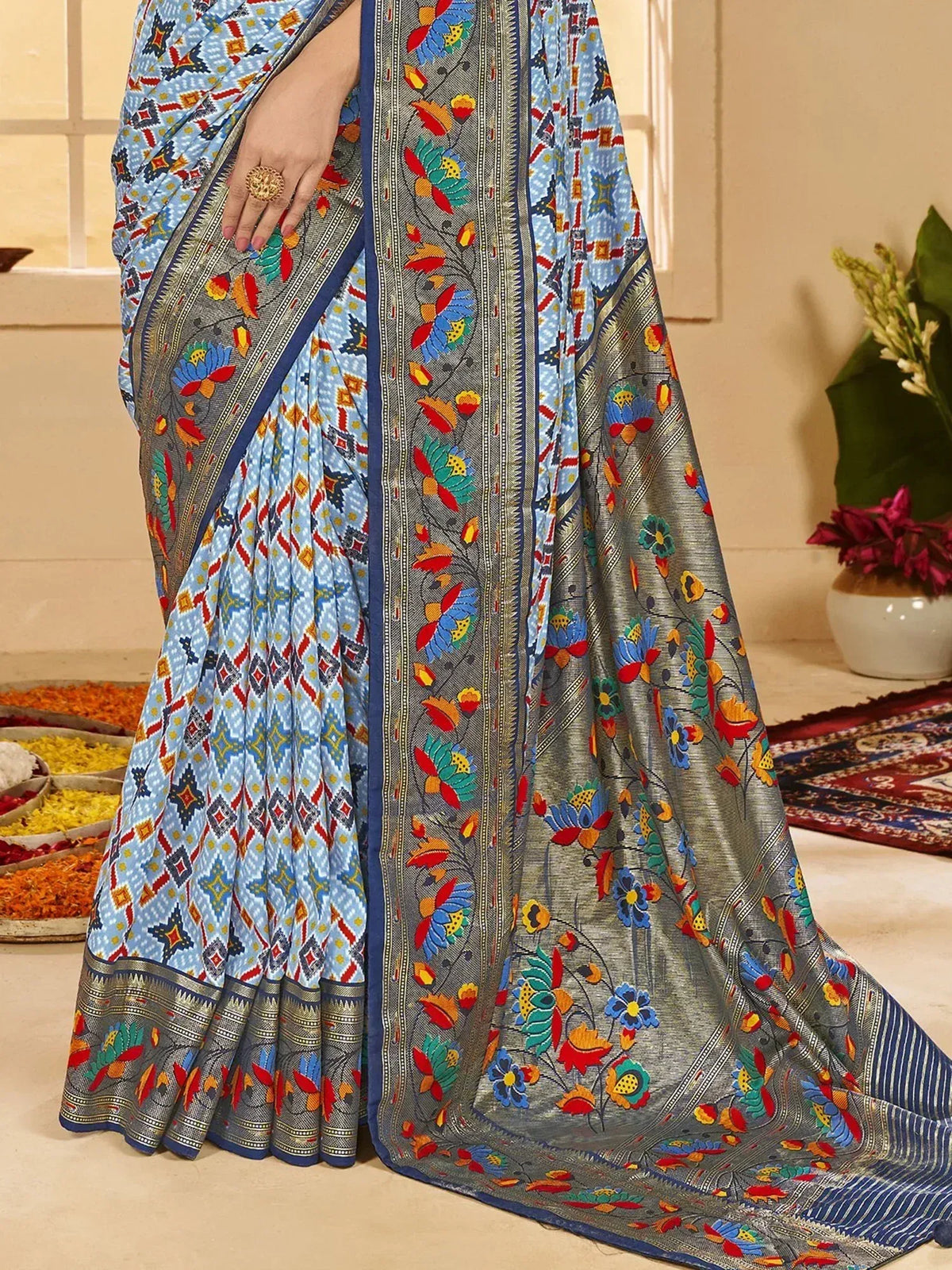 Blue and grey floral printed saree with geometric border, ideal for ethnic wear occasions
