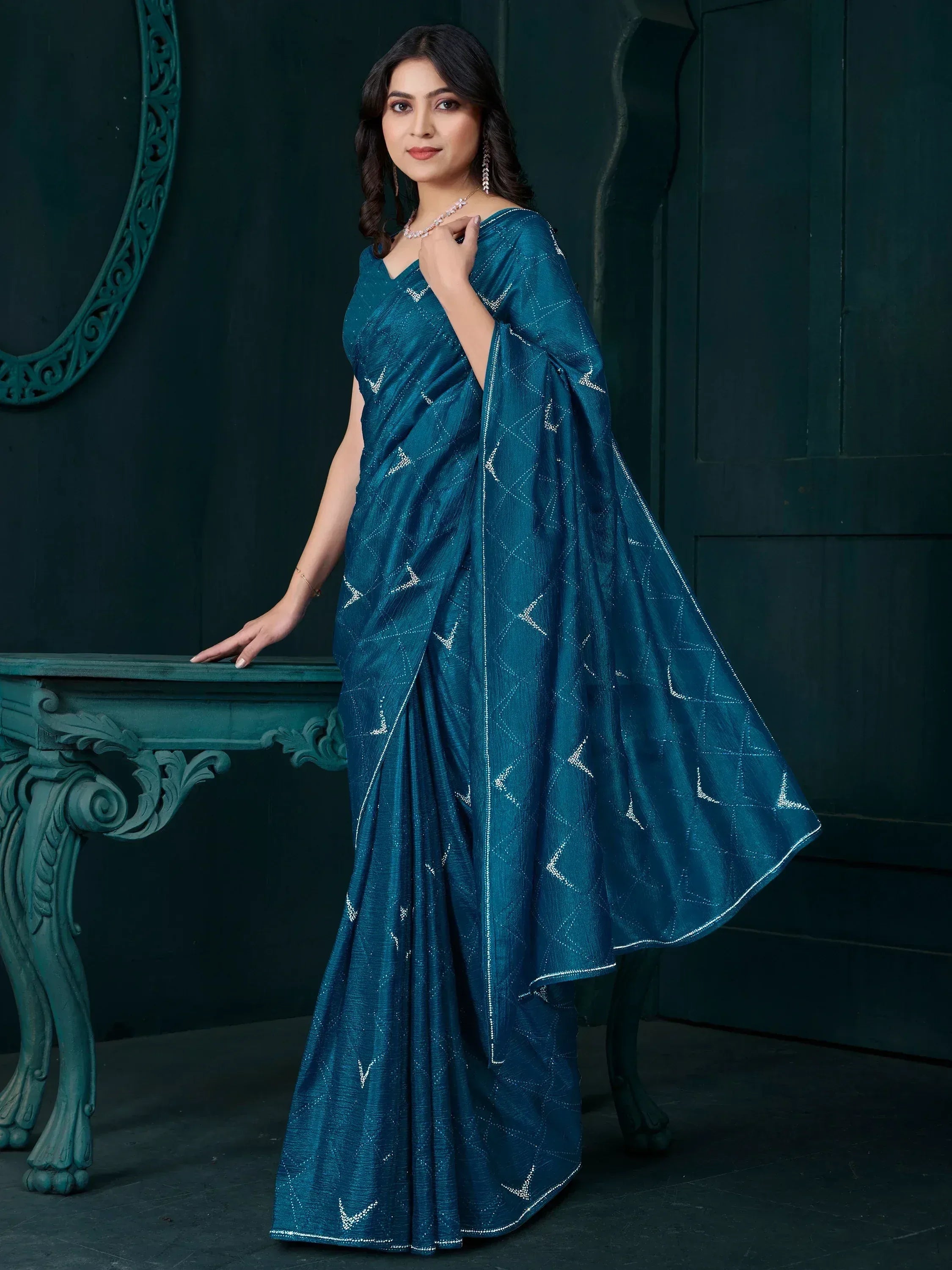 Teal blue saree with silver geometric embroidery, elegant Indian ethnic wear for women