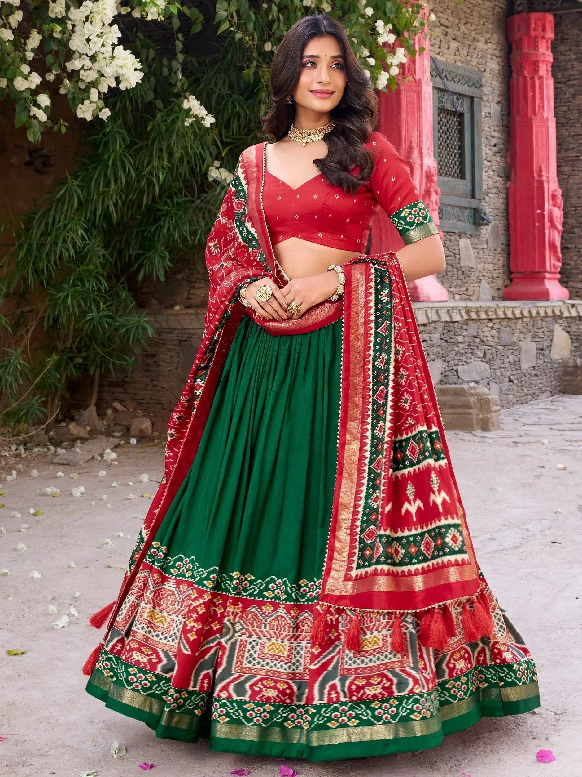Red and green designer lehenga choli with ethnic print, perfect for Indian weddings and festivals