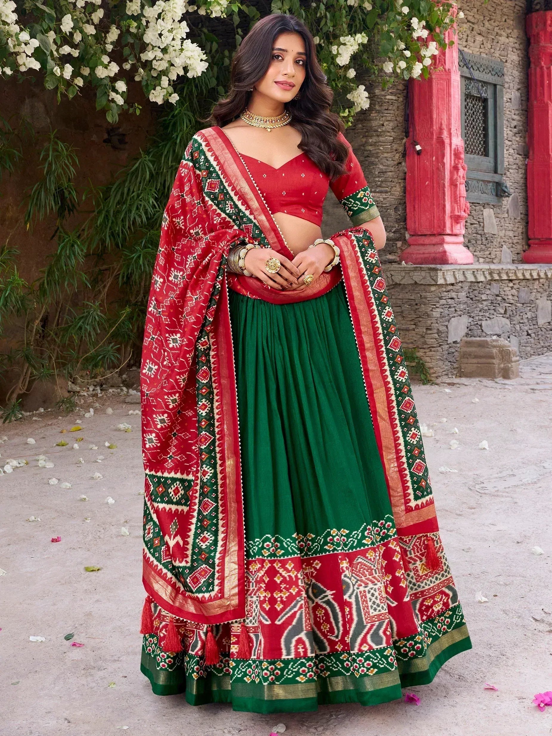 Red and green ethnic lehenga choli with printed dupatta, perfect for Indian festivals and weddings
